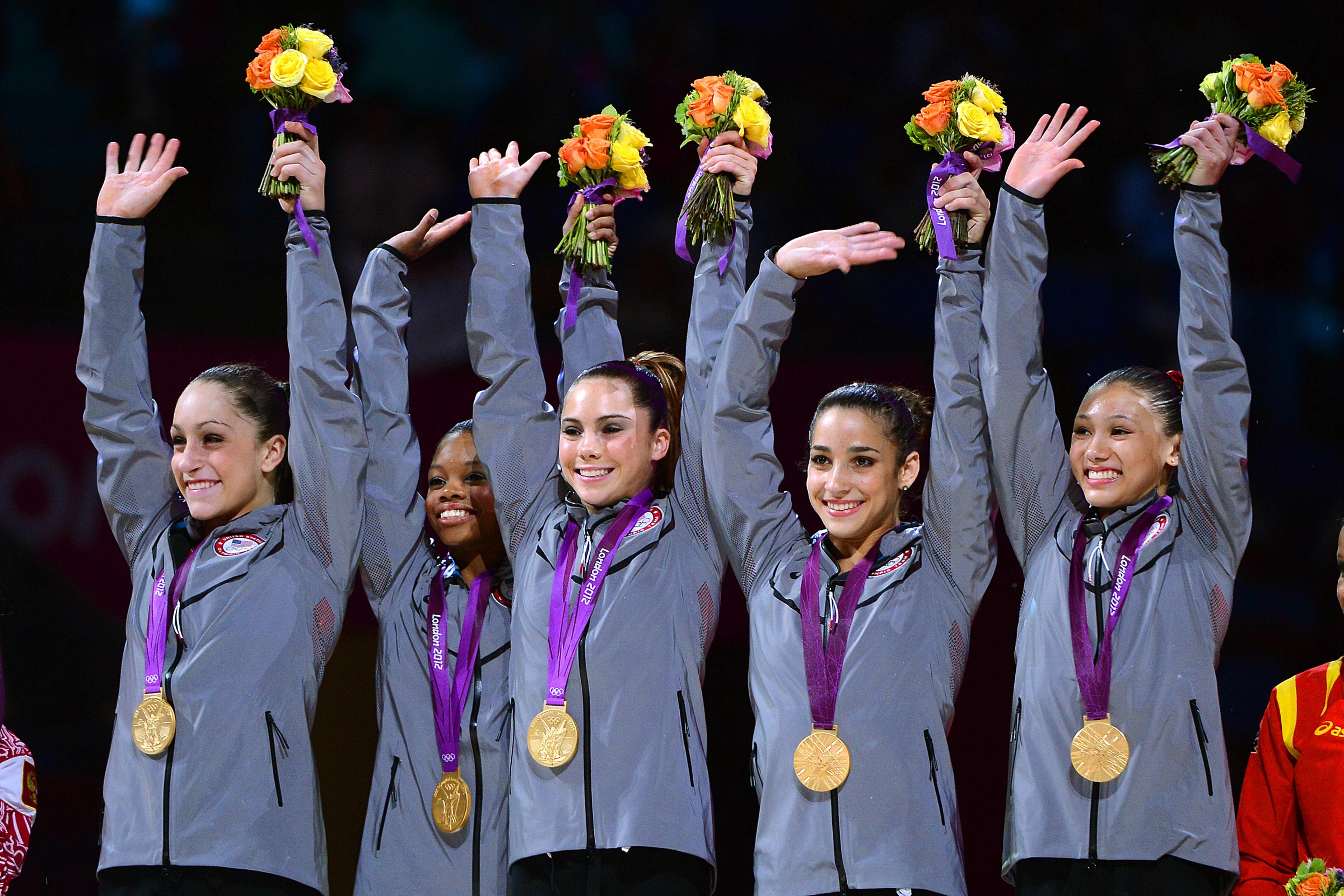 McKayla Maroney, center, celebrates with her team after winning gold in the Women's Team Final at the 2012 London Olympics.