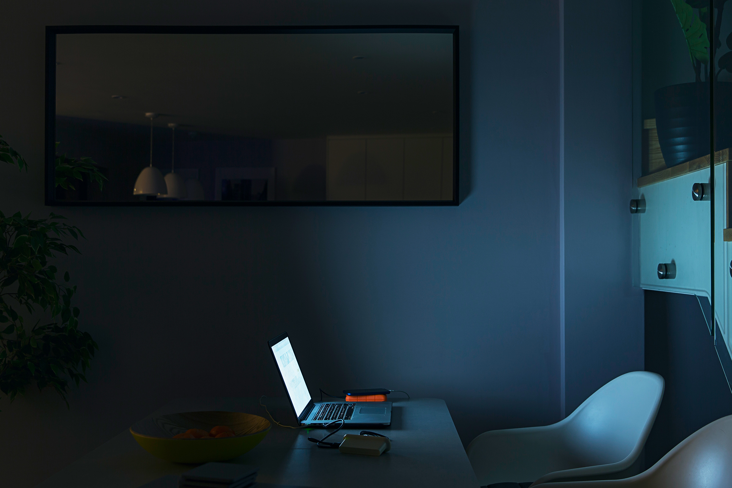 Makeshift home office in a dark room