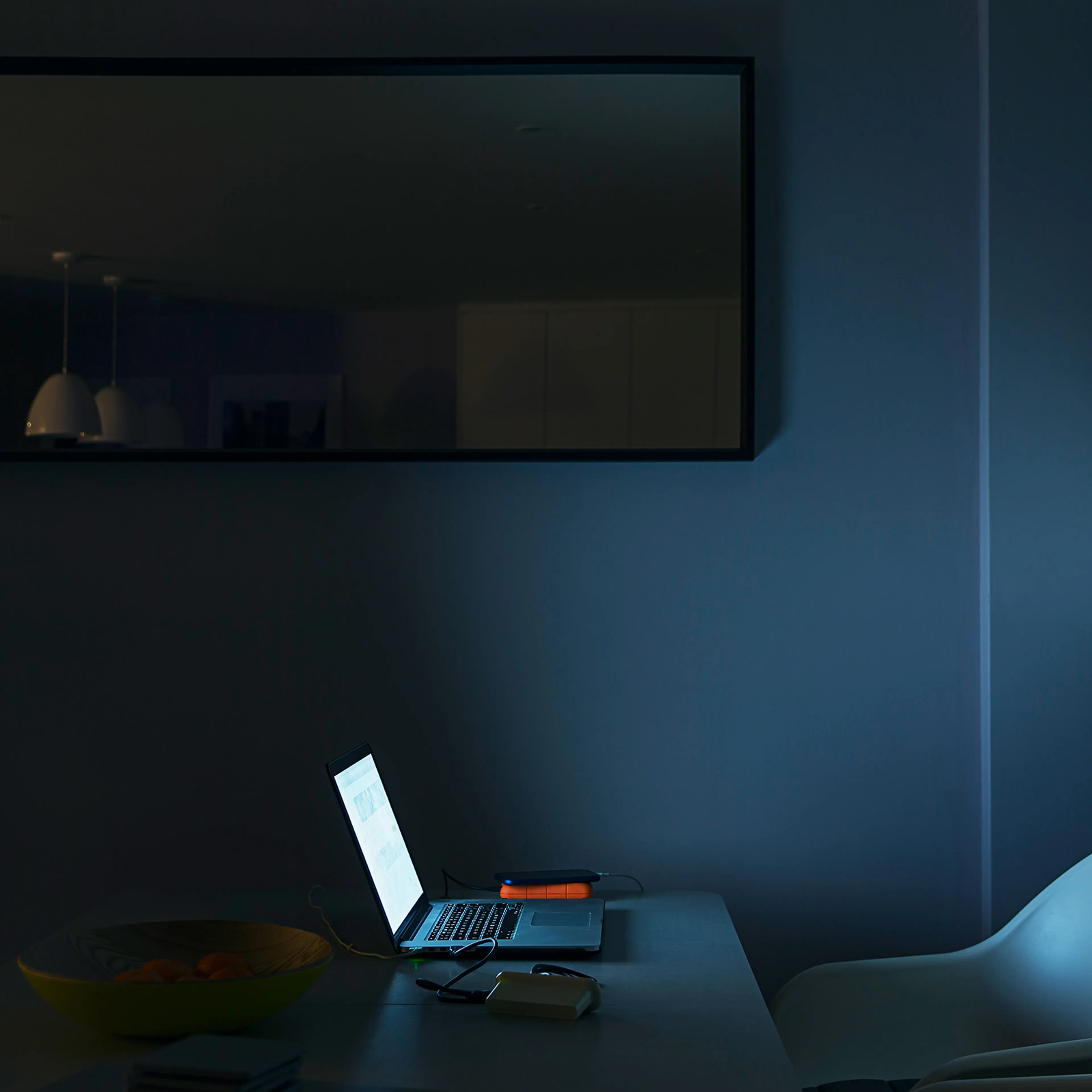 Makeshift home office in a dark room
