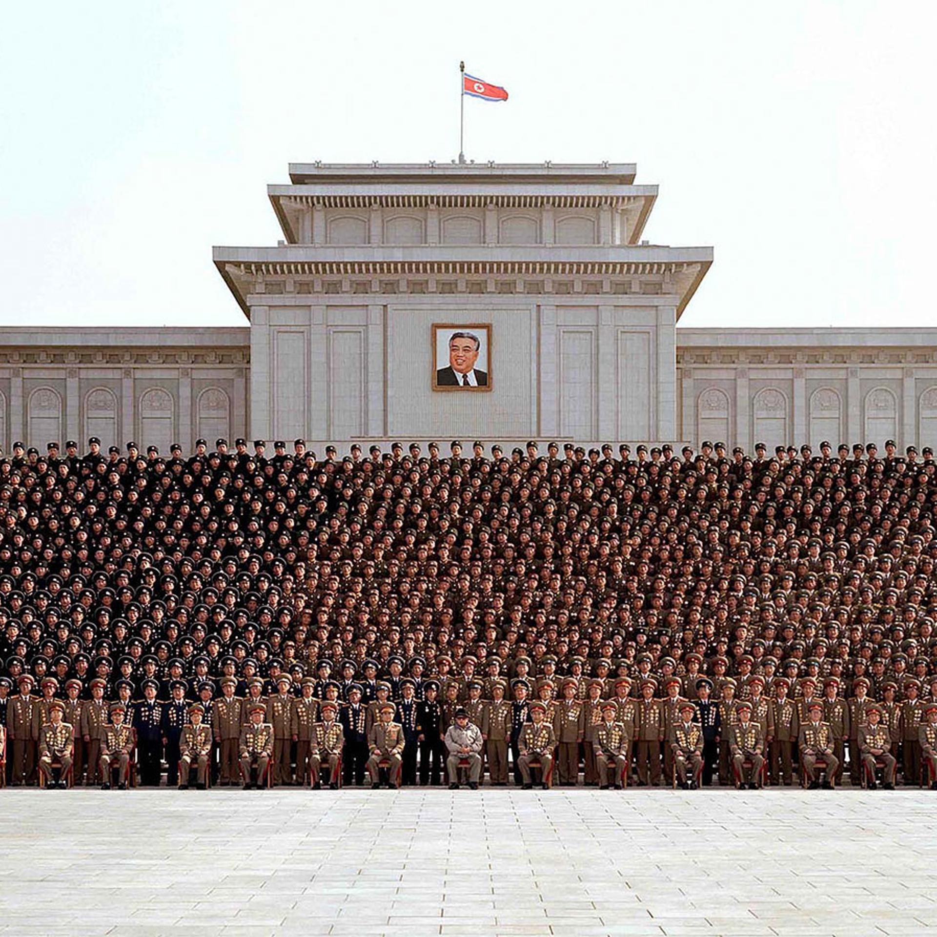 This undated photo, released by North Korea's official Korean Central News Agency (KCNA) on Mar. 20, 2009, shows Kim Jong Il (front row, center) posing at a meeting of active outpost soldiers at the plaza of the Kumsusan Memorial Palace in Pyongyang.