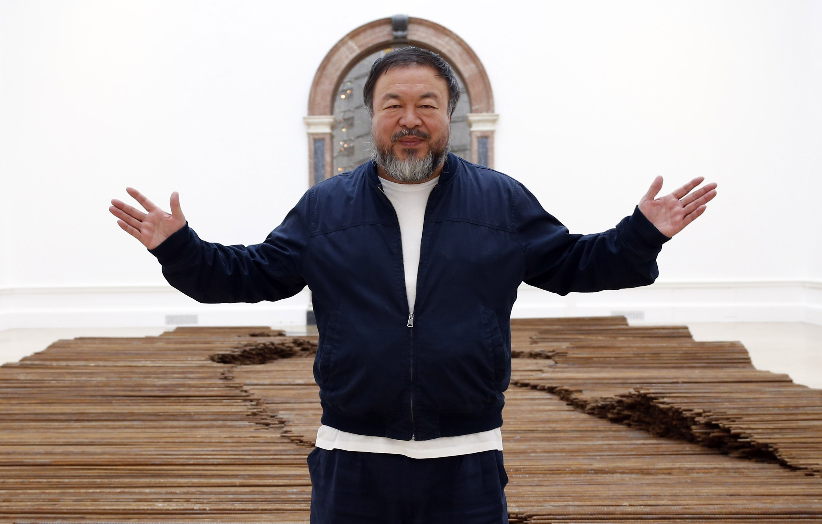 Ai Weiwei stands with his sculpture 'Straight' as he previews works from his landmark art exhibition in London on Sept. 15, 2015.