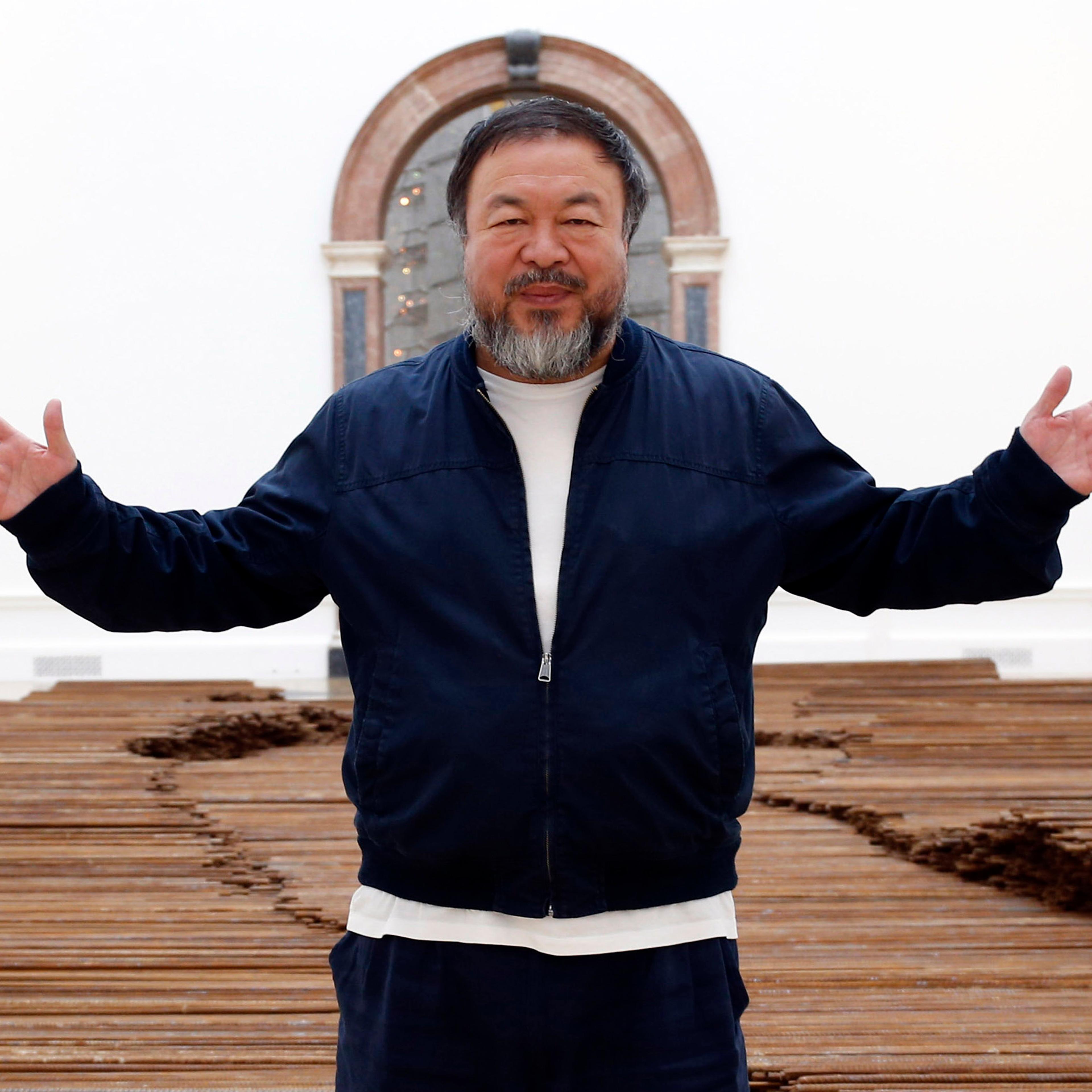 Ai Weiwei stands with his sculpture 'Straight' as he previews works from his landmark art exhibition in London on Sept. 15, 2015.