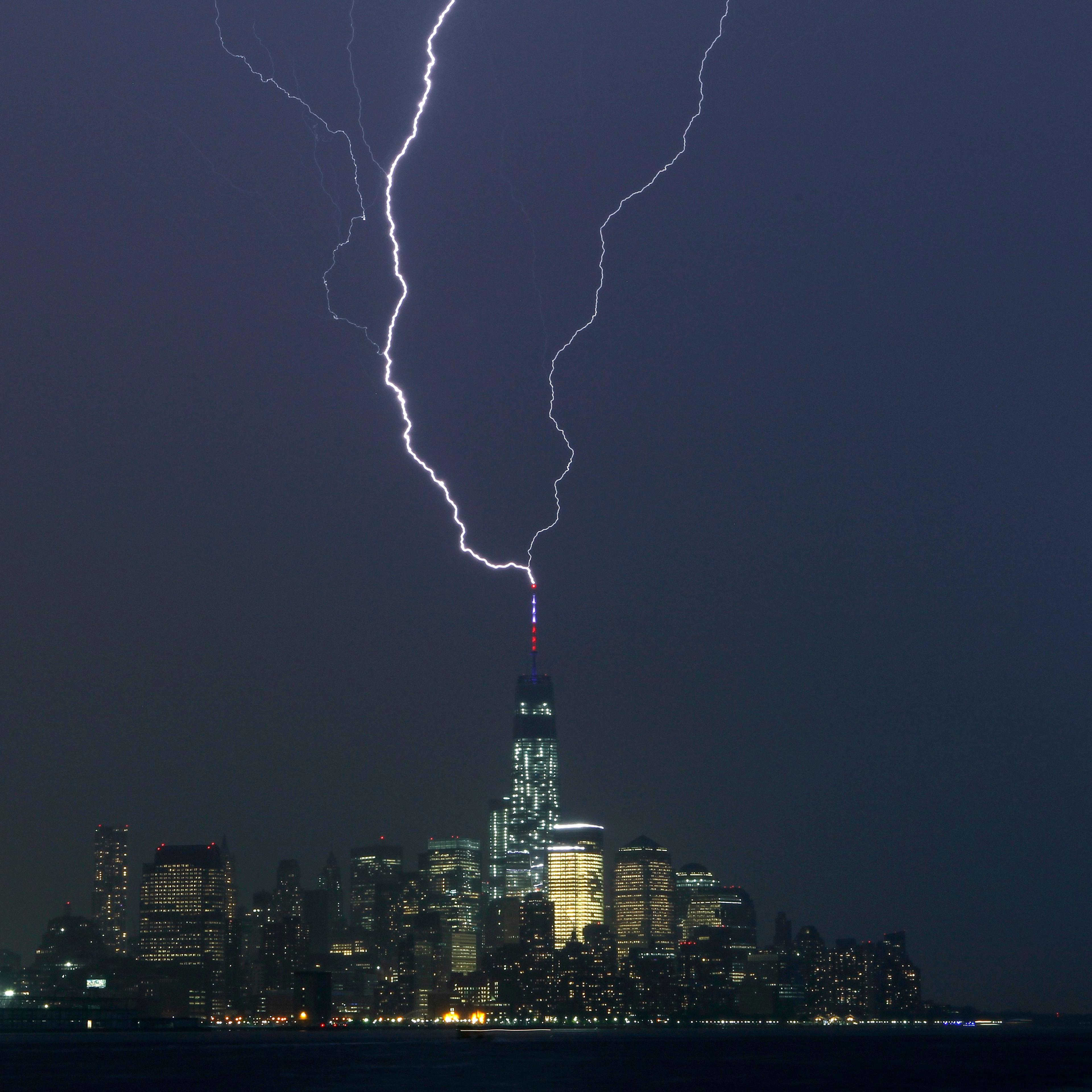 Two bolts of lightning hit the antenna on top of One World Trade Center in Lower Manhattan as an ele