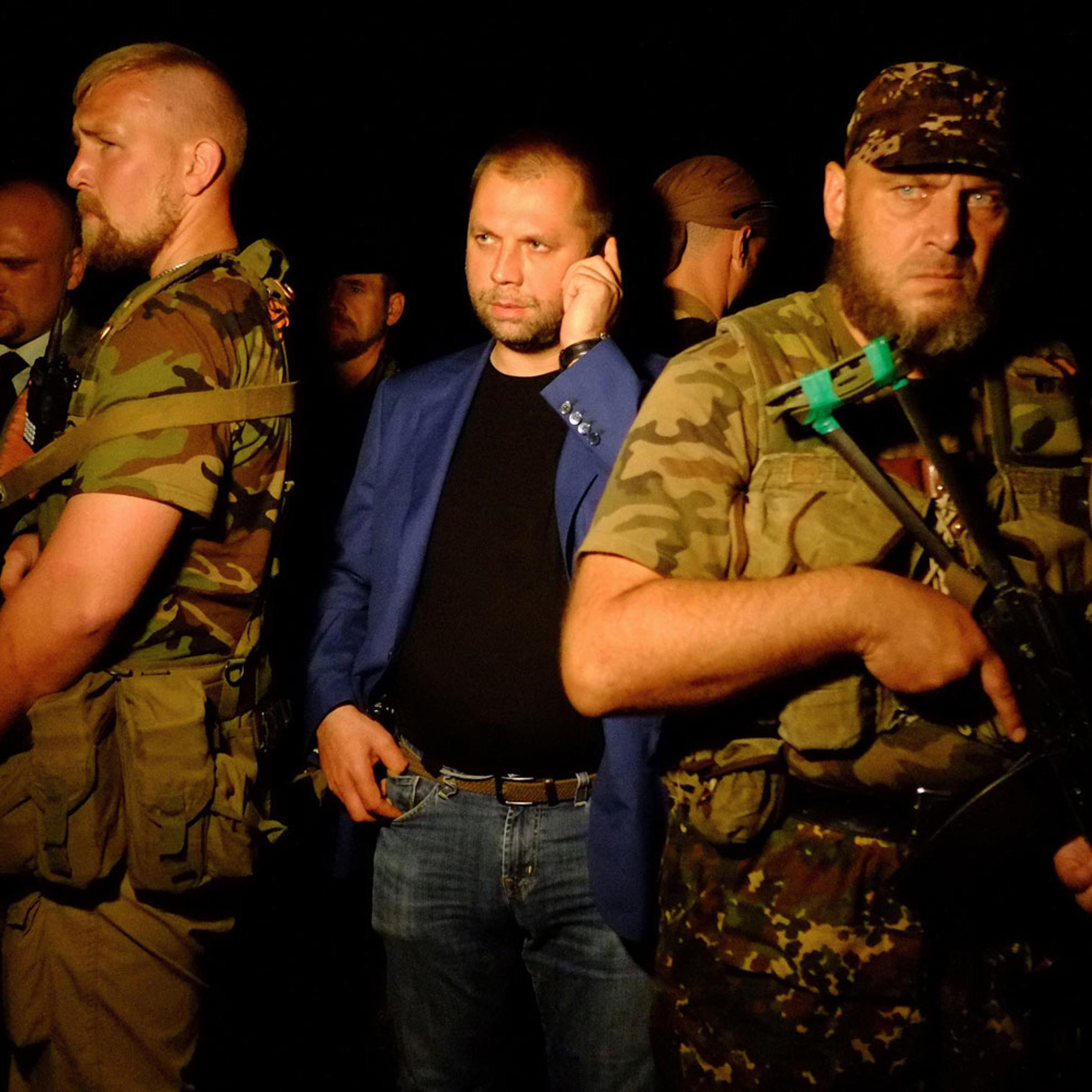 Self-proclaimed Prime Minister of the pro-Russian separatist "Donetsk People's Republic" Alexander Borodai stands as he arrives on the site of the crash of a malaysian airliner carrying 298 people from Amsterdam to Kuala Lumpur, near the town of Shaktars