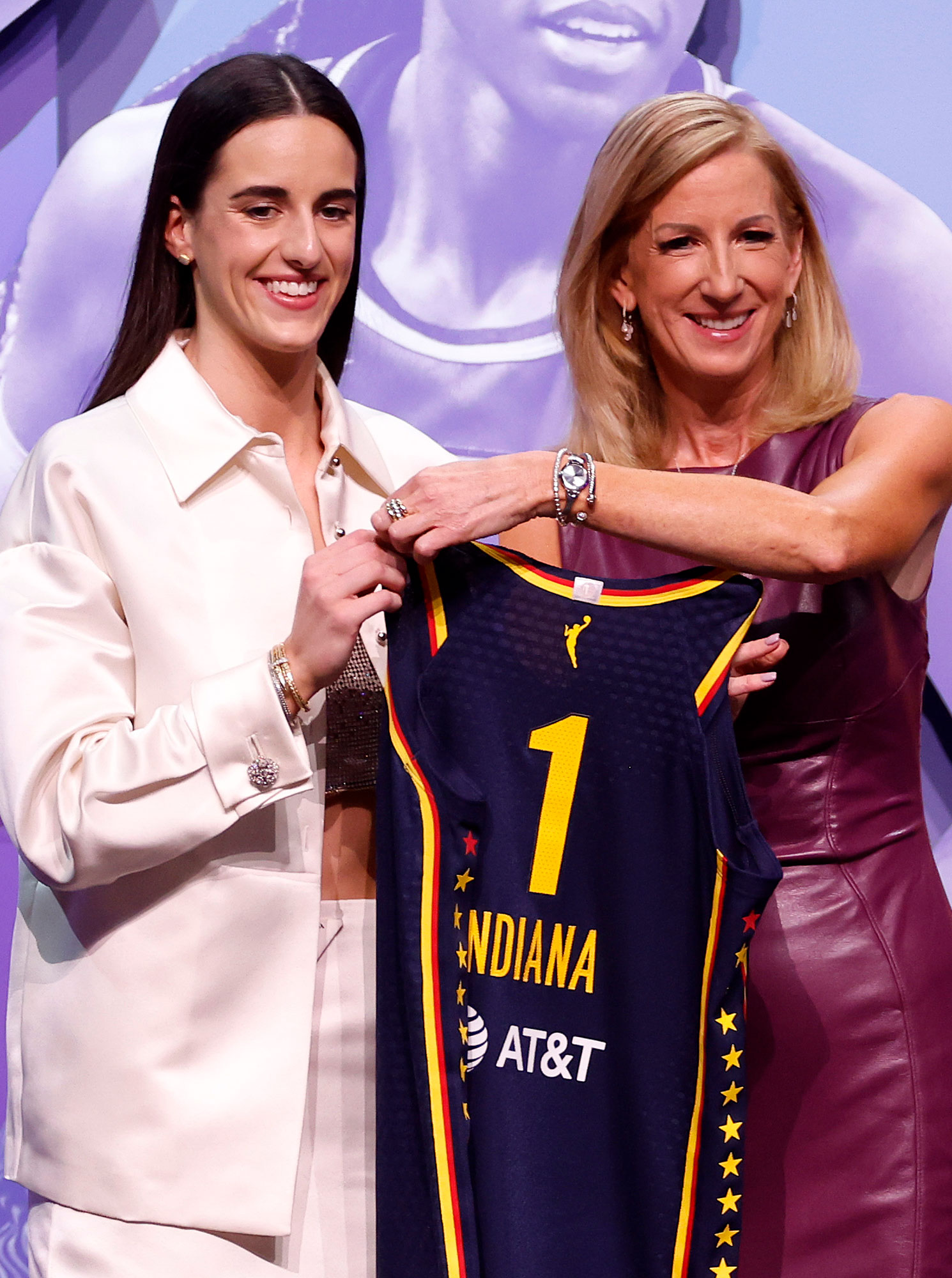 Caitlin Clark poses with WNBA Commissioner Cathy Engelbert after being selected first overall pick by the Indiana Fever during the 2024 WNBA Draft.