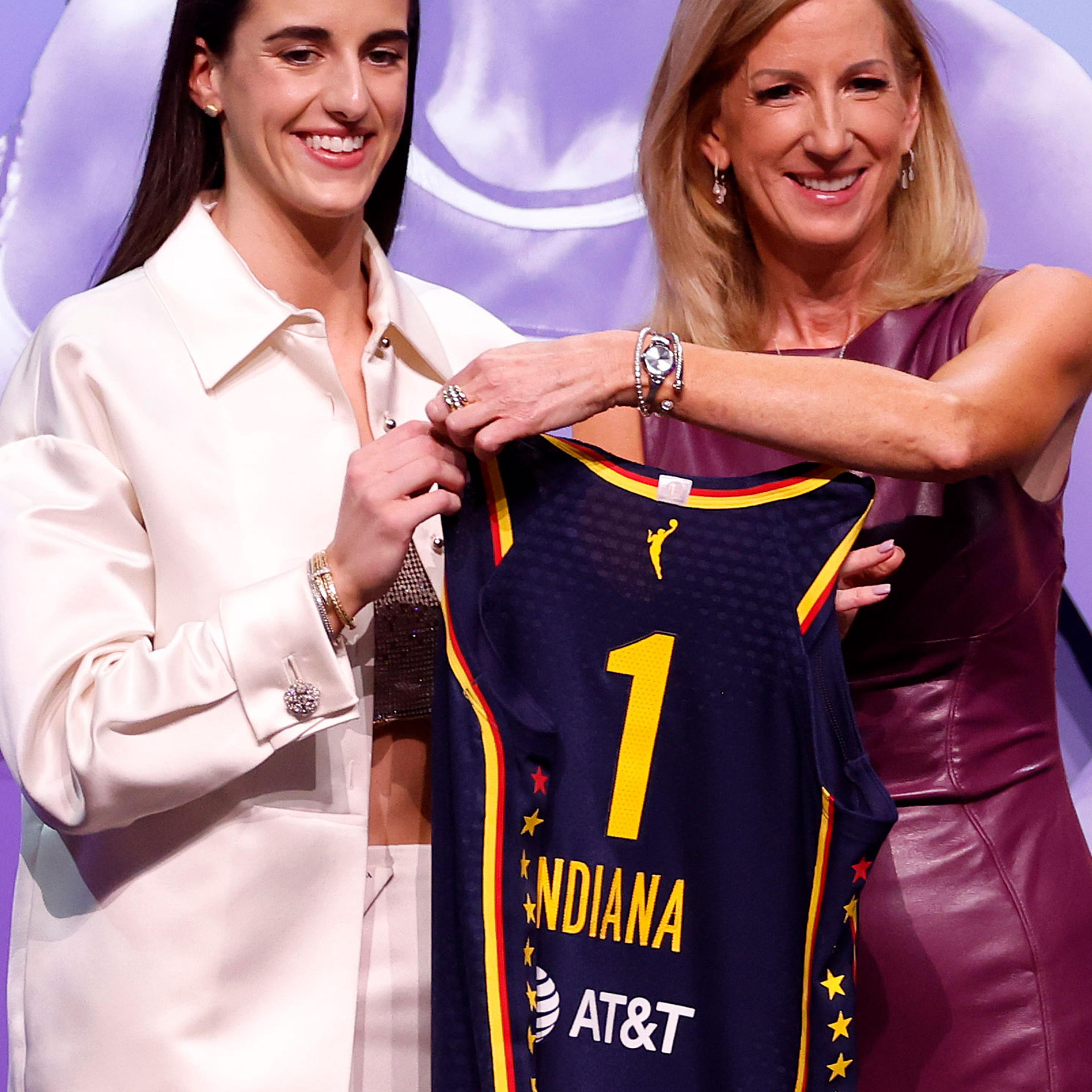 Caitlin Clark poses with WNBA Commissioner Cathy Engelbert after being selected first overall pick by the Indiana Fever during the 2024 WNBA Draft.