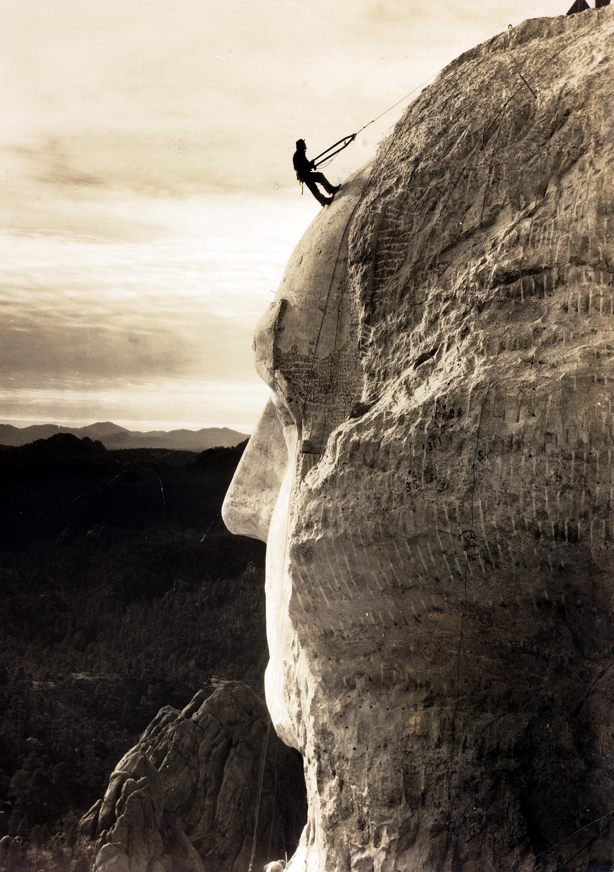 Popperfoto.The Book. Volume 1.Page: 93. Picture: 9. A man on the head of George Washington at Mount Rushmore, South Dakota, U.S.A. circa 1930.