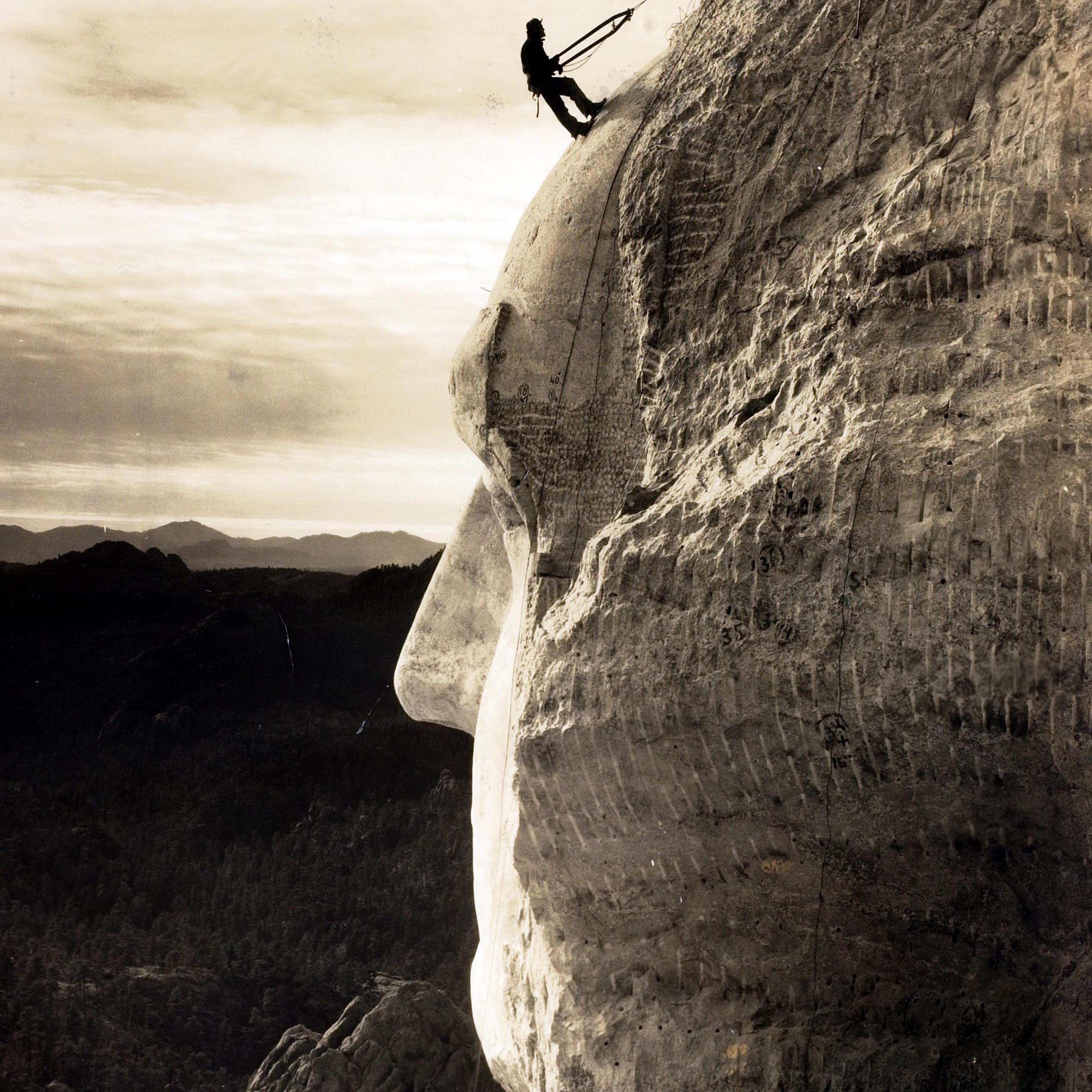 Popperfoto.The Book. Volume 1.Page: 93. Picture: 9. A man on the head of George Washington at Mount Rushmore, South Dakota, U.S.A. circa 1930.