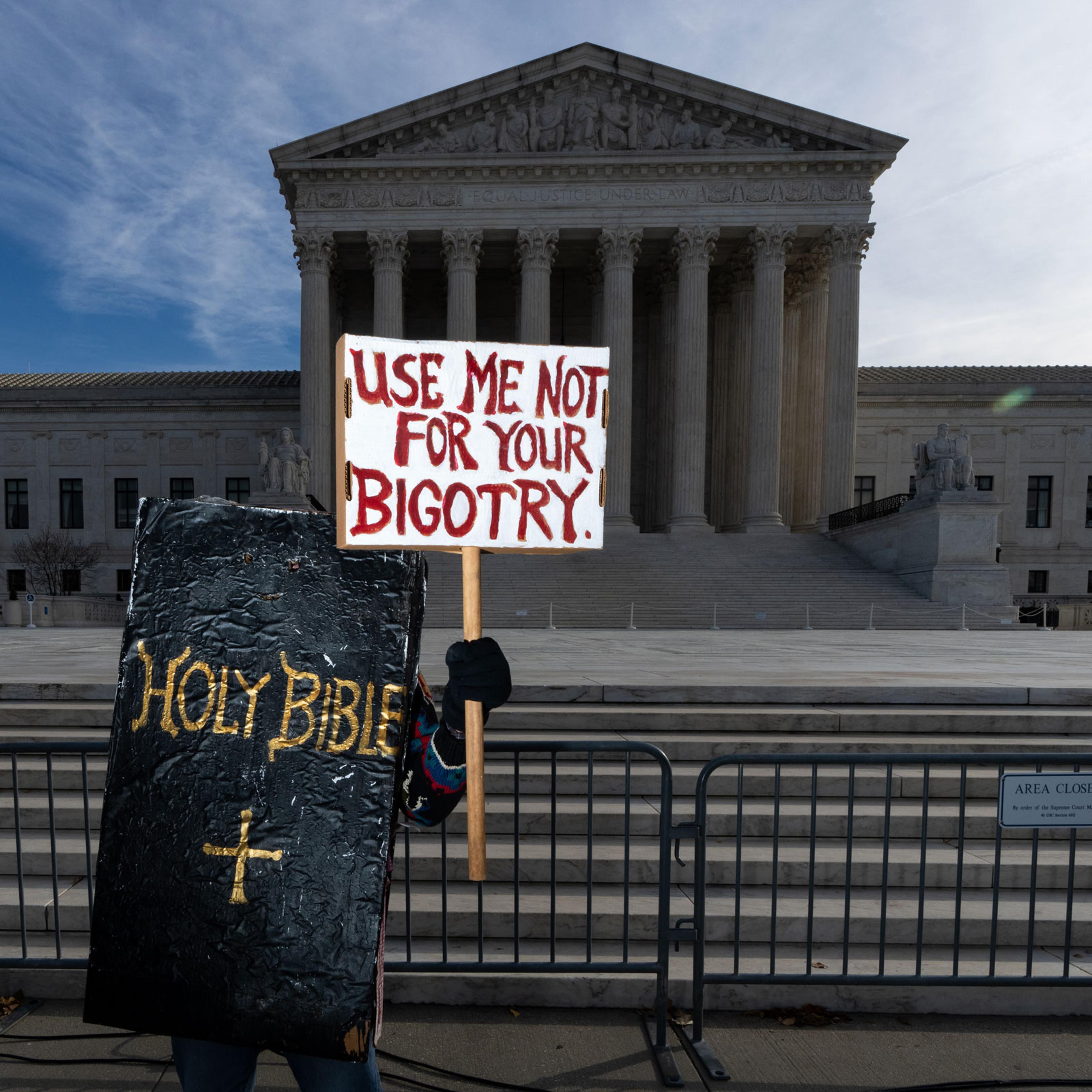 A protester dressed in a bible costume stands in front of the U.S. Supreme Court on Nov. 5, 2022.
