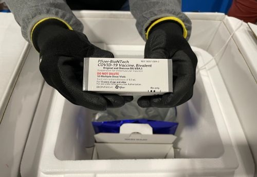 Doses of Pfizer-BioNTech's Omicron bivalent booster vaccine being packed for storage and distribution at Pfizer's facility in Pleasant Prairie, Wis. 
