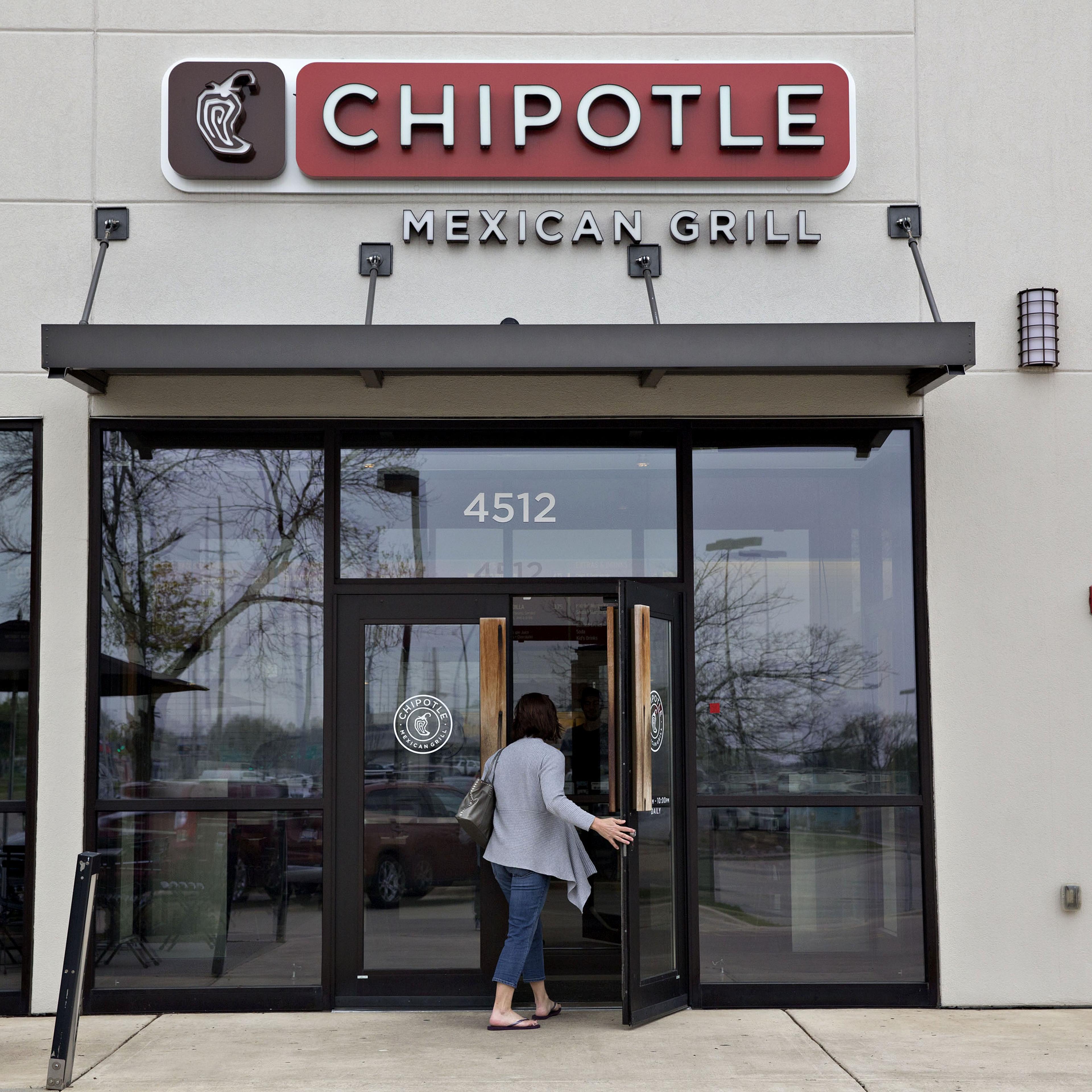 A customer enters a Chipotle Mexican Grill Inc. restaurant in Peoria, Illinois, on April 22, 2016.