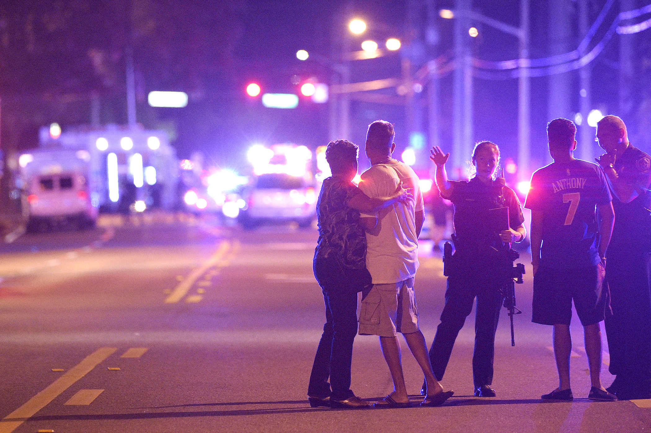 Orlando Police officers direct family members away from a fatal shooting at Pulse Orlando nightclub in Orlando, Florida, June 12, 2016.