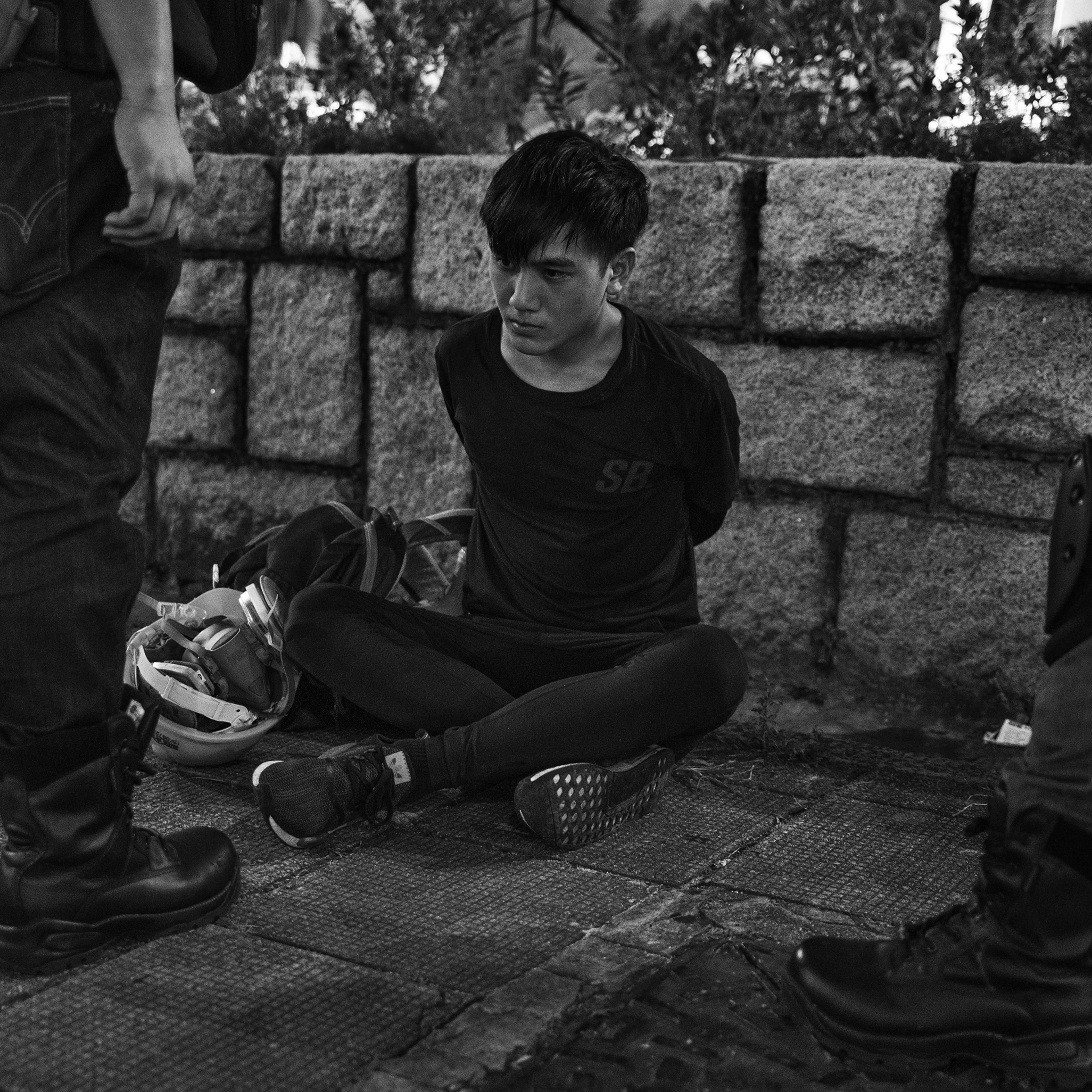 An antigovernment protester is arrested near the Tsim Sha Tsui police station in Kowloon, Hong Kong, on Aug. 11.