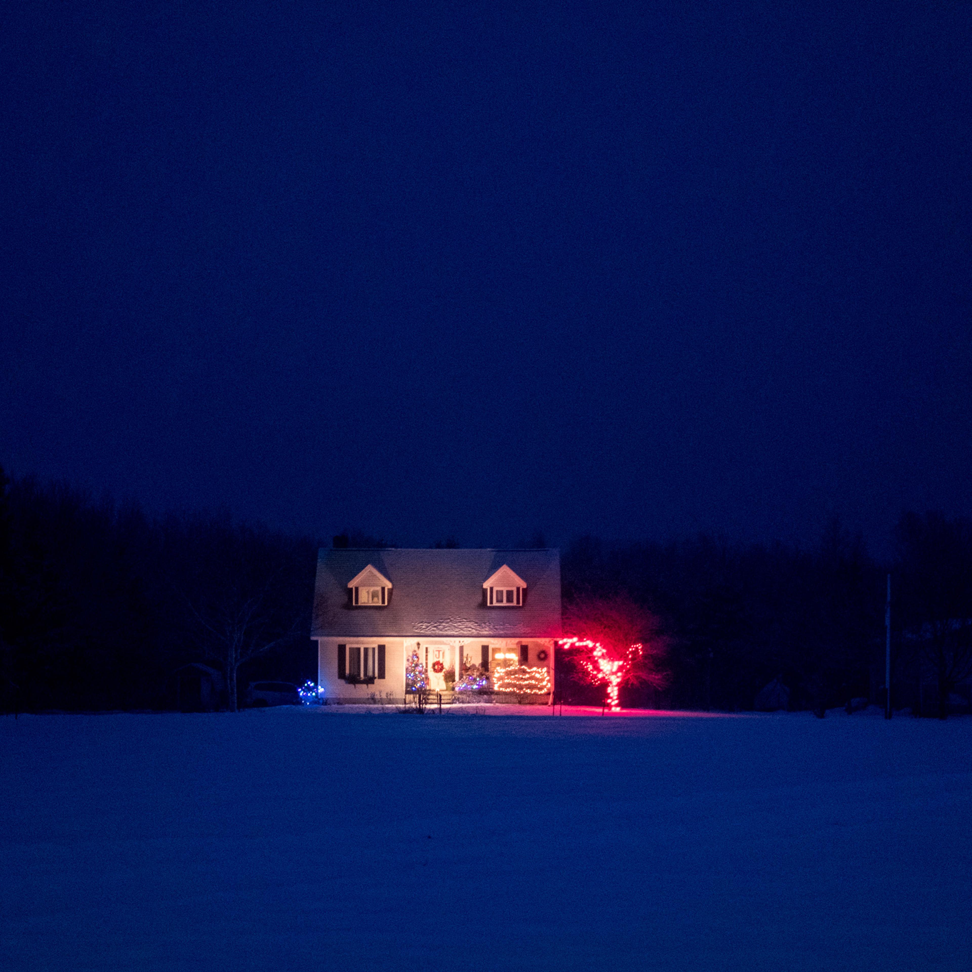 Solo home lit up with Christmas lights