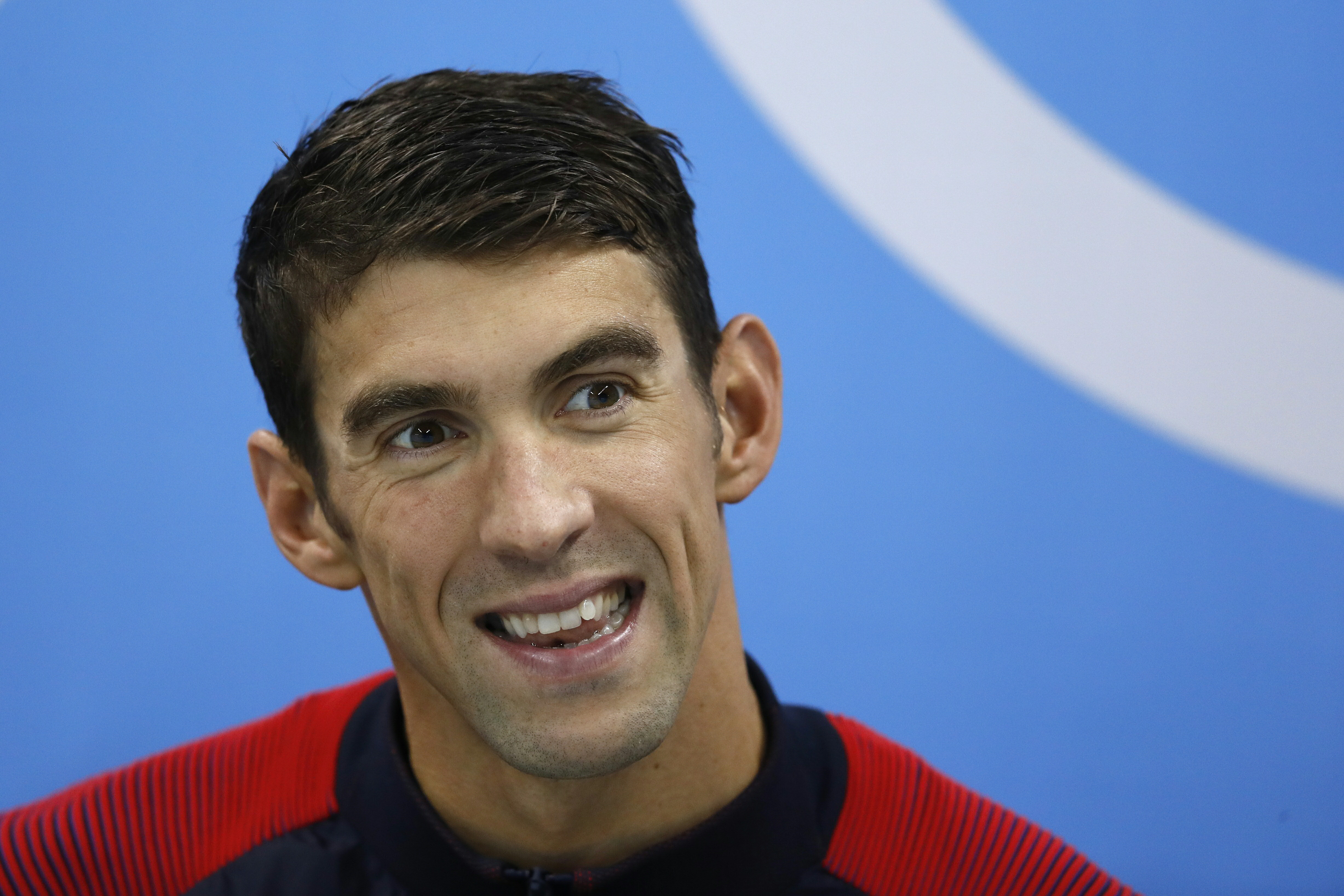 USA's Michael Phelps smiles during the podium ceremony of the Men's swimming 4 x 100m Medley Relay Final at the Rio 2016 Olympic Games at the Olympic Aquatics Stadium in Rio de Janeiro on August 13, 2016.