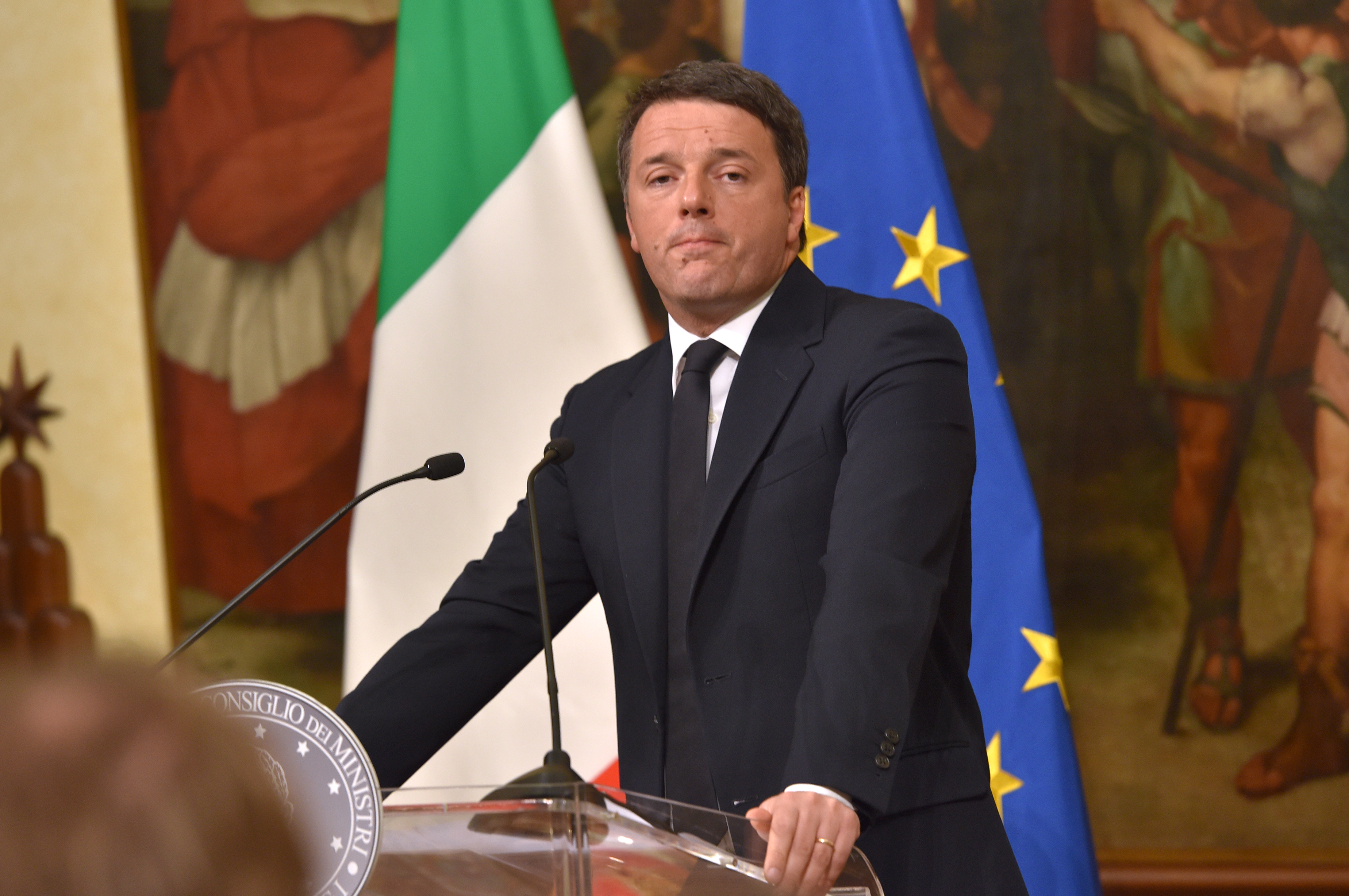 Italy's Prime Minister Matteo Renzi announces his resignation during a press conference at the Palazzo Chigi following the results of the vote for a referendum on constitutional reforms, on December 5, 2016 in Rome.