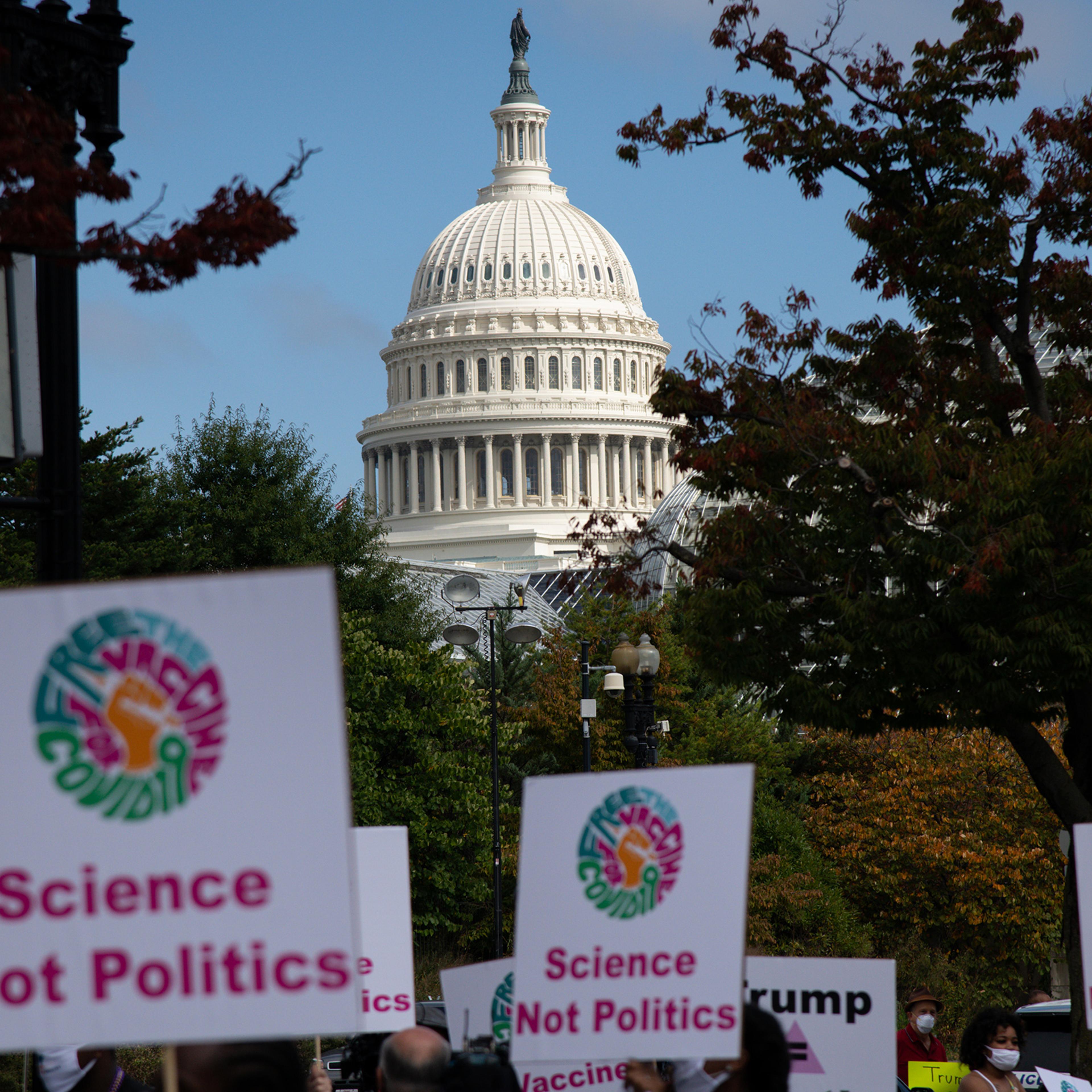 A view of the U.S. Capitol Building as demonstrators march to the Department of Health and Human Services (HHS) headquarters during a protest organized by groups calling for safe vaccines on Oct. 21