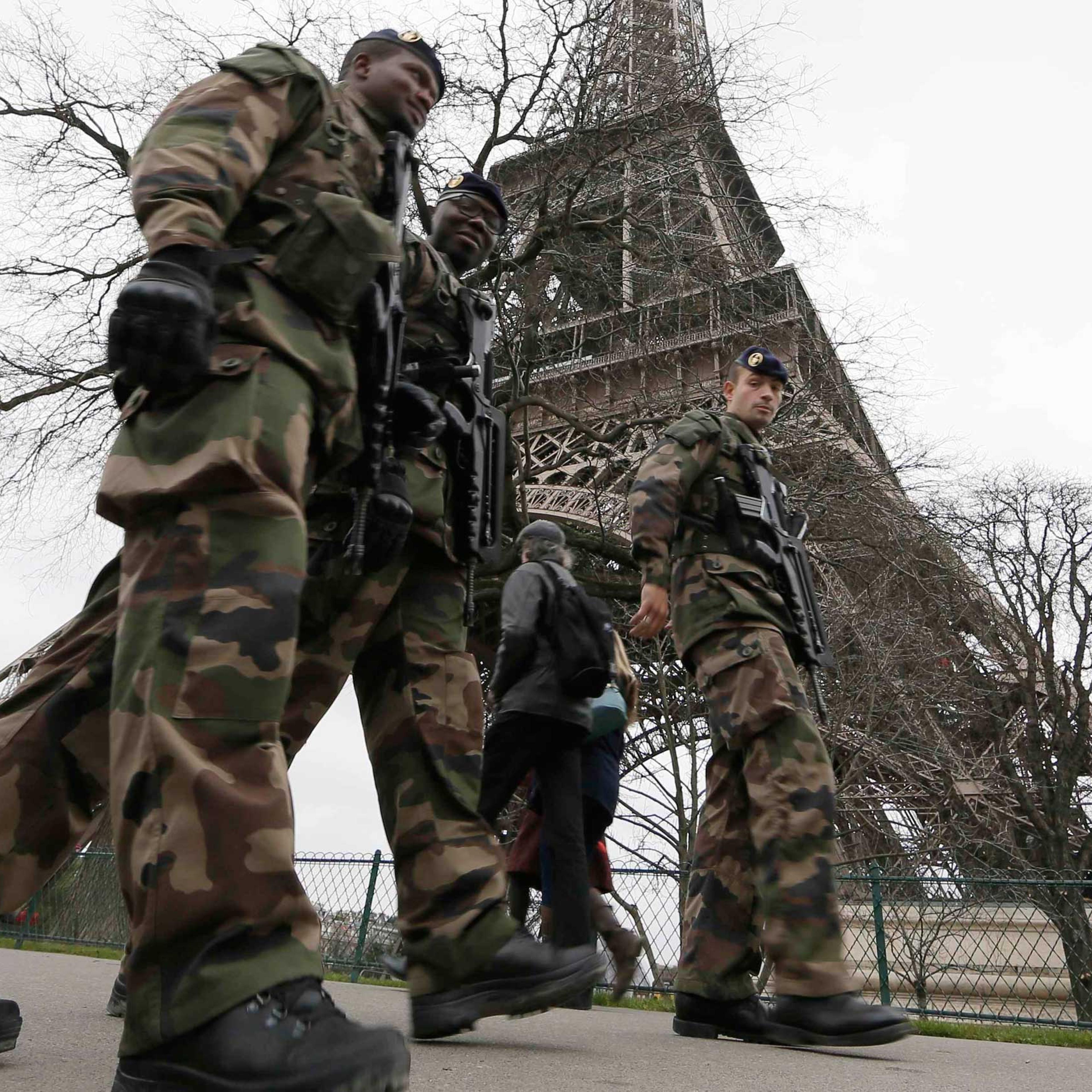 French soldiers patrol near the Eiffel Tower in Paris as part of the "Vigipirate" security plan