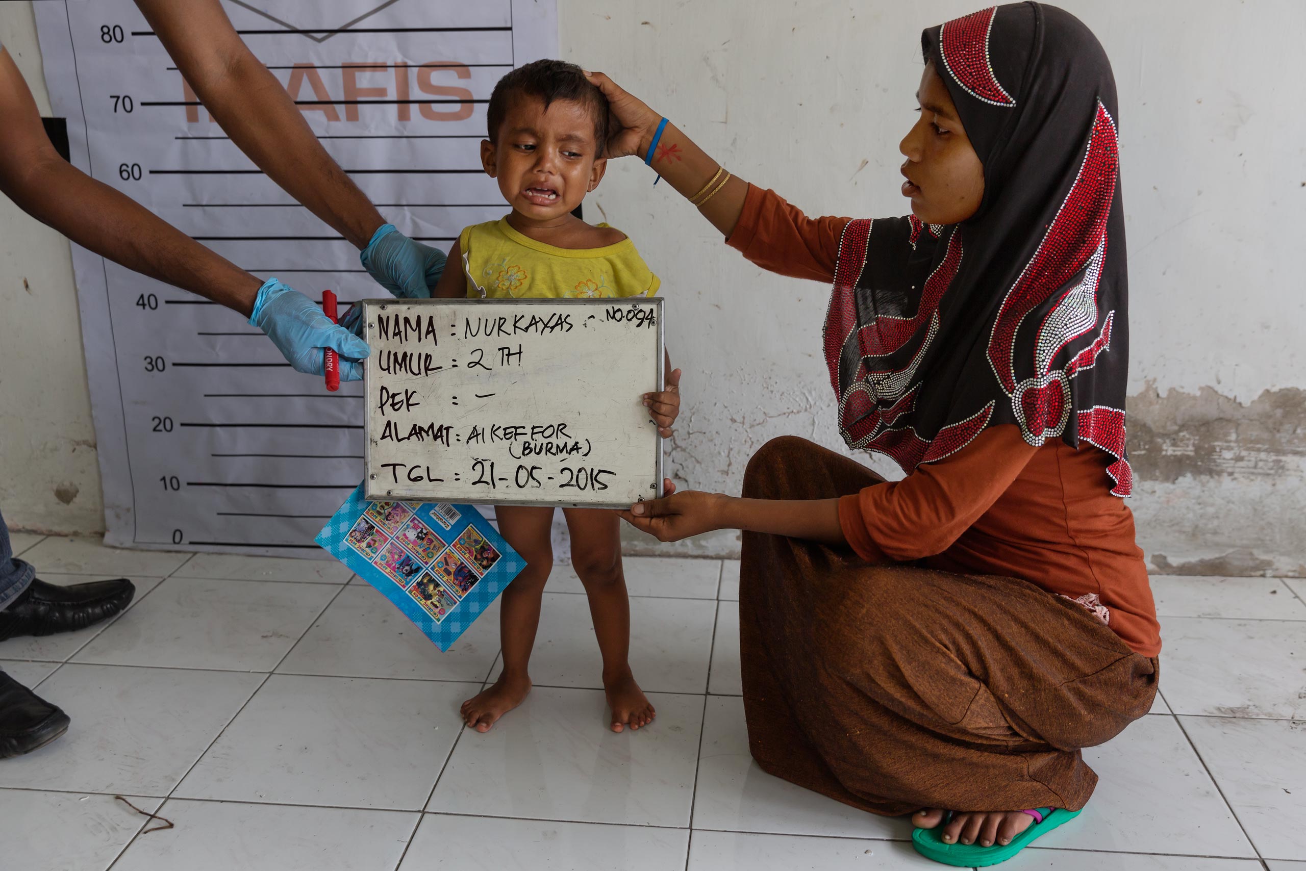 Rohingya and Bangladeshi refugees aboard boats that have been at sea for months off the coast of SE Asia. Landed in port pif Langsa in Aceh, Indonesia, where they were given shelter, food and medical care by Indonesian and international NGO's. The Rohing