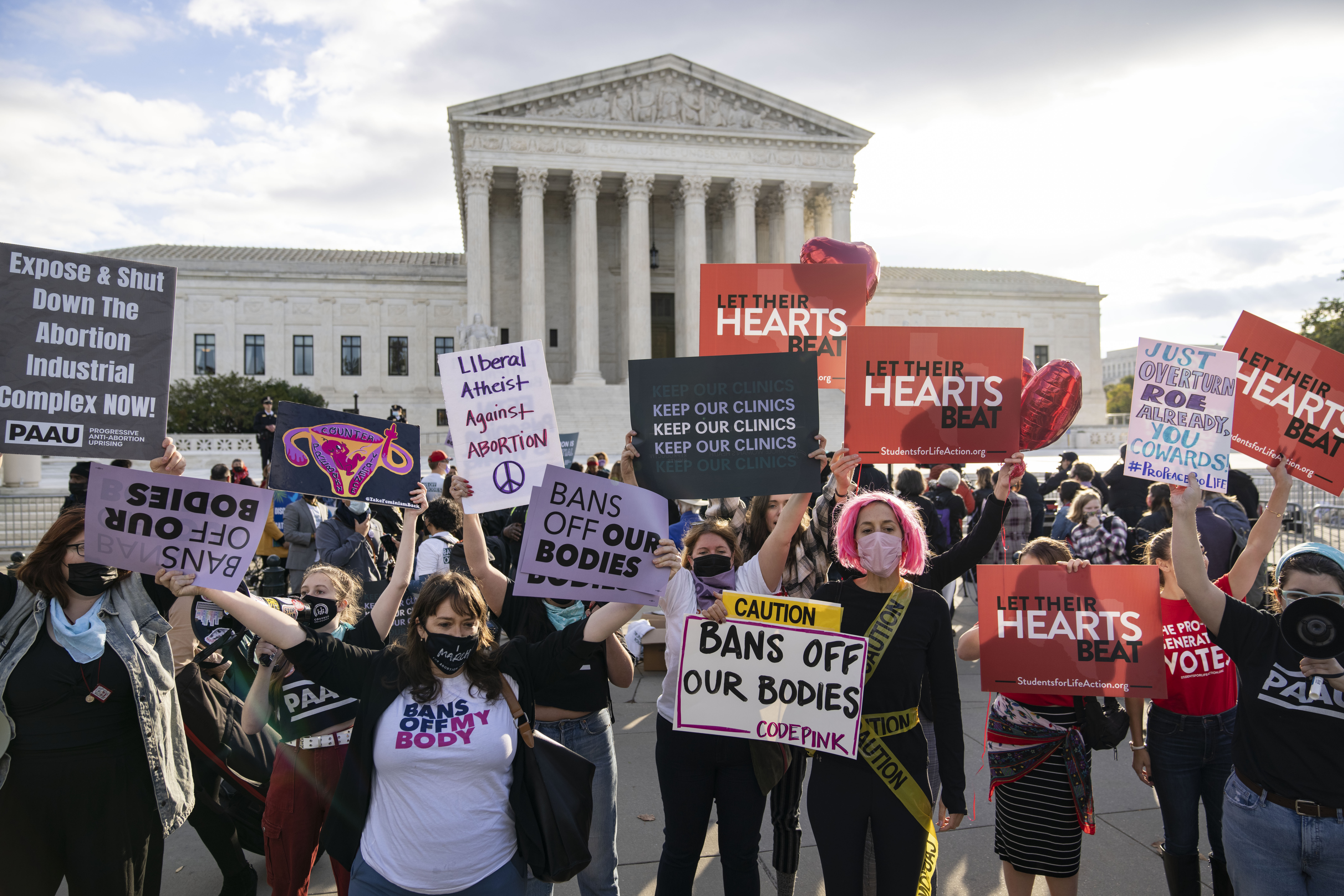 Abortion rights advocates and anti-abortion demonstrators rally outside the Supreme Court on Nov. 1, in Washington, D.C.