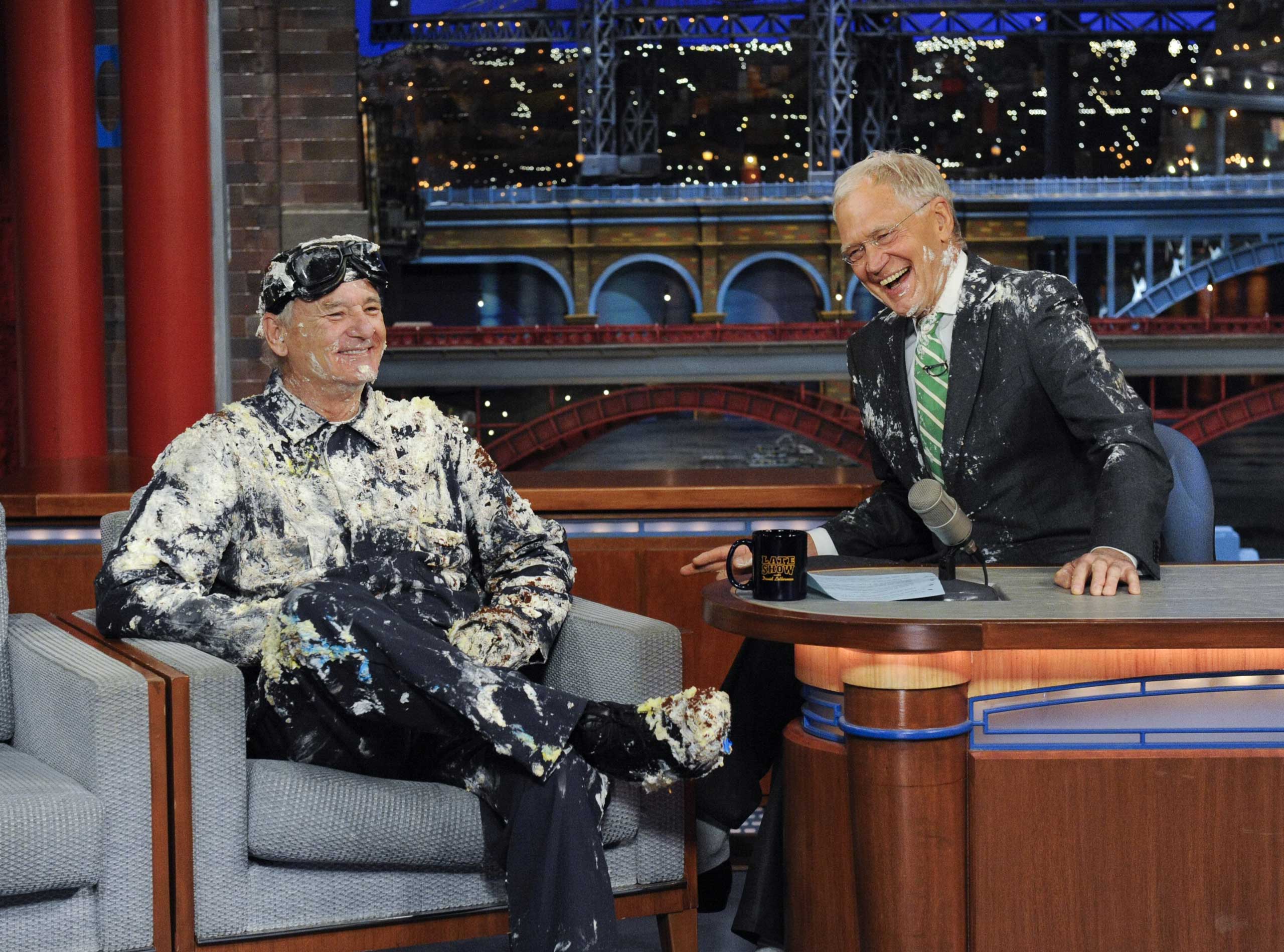 Bill Murray jumps out of giant cake, when he makes his final appearance on the Late Show with David Letterman, May 19, 2015.
