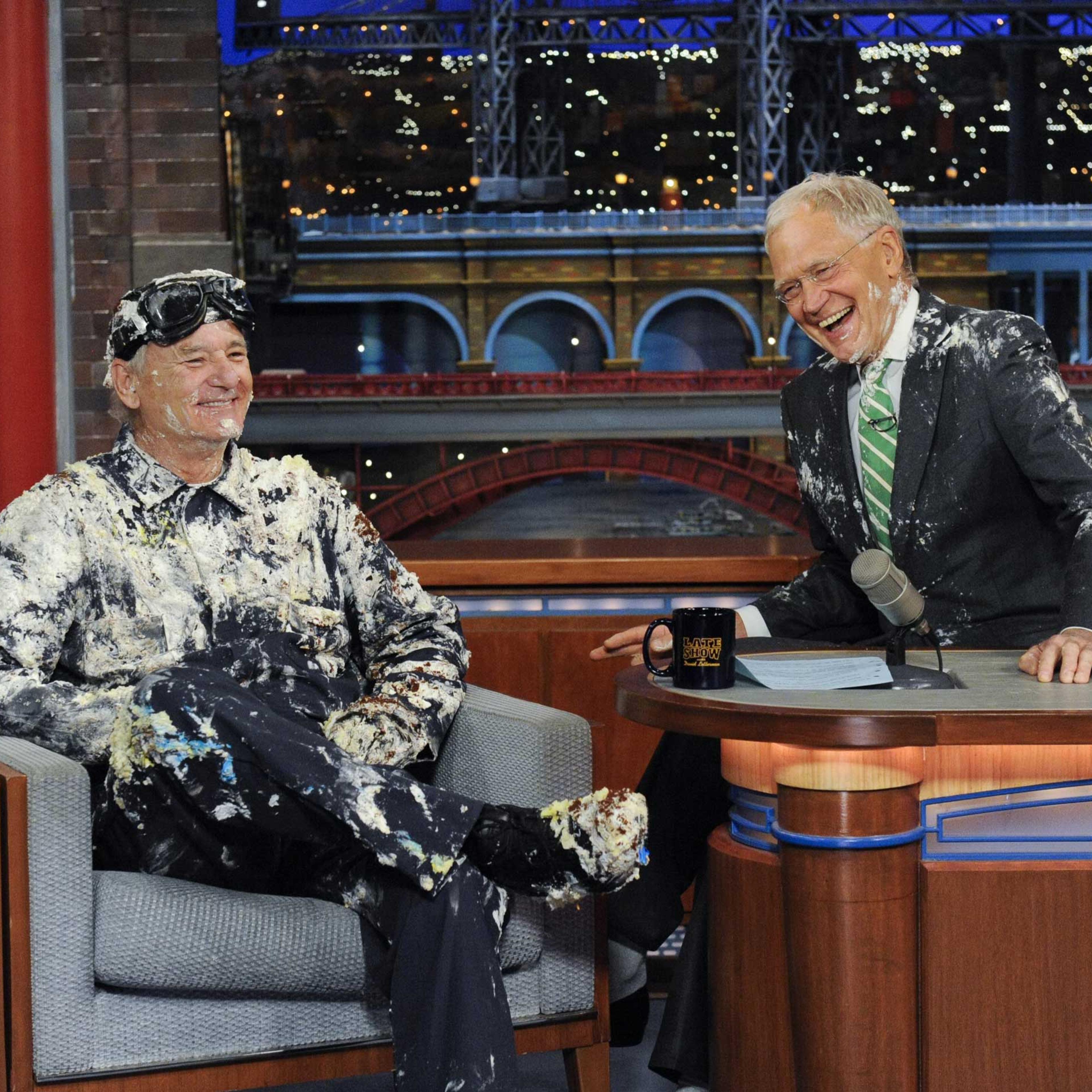 Bill Murray jumps out of giant cake, when he makes his final appearance on the Late Show with David Letterman, May 19, 2015.