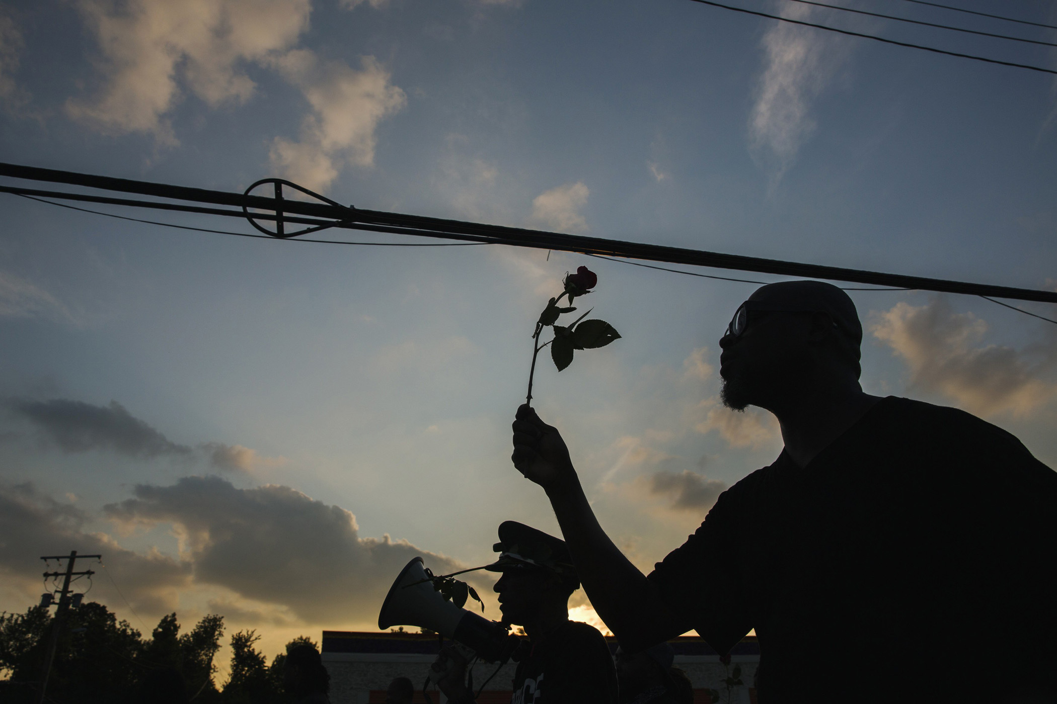 Demonstrators march down West Florissant during a peaceful march in reaction to the shooting of Michael Brown, near Ferguson, Mio., Aug. 18, 2014.