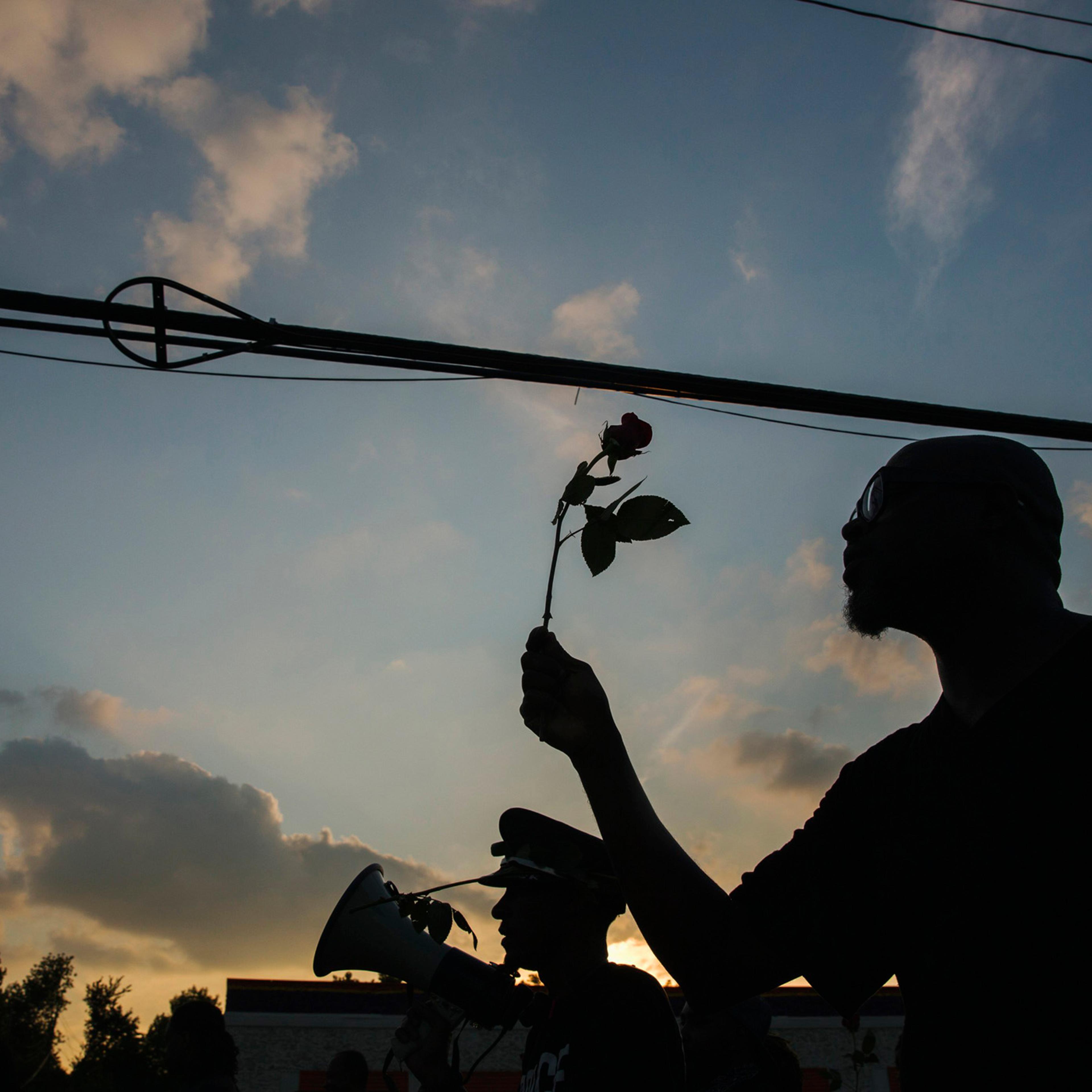 Demonstrators march down West Florissant during a peaceful march in reaction to the shooting of Michael Brown, near Ferguson, Mio., Aug. 18, 2014.