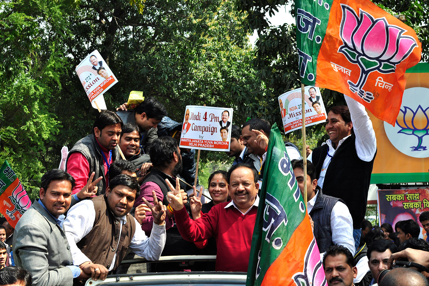 BJP Delhi president Harsh Vardhan launches a rally promoting Narendra Modi as the prime-ministerial candidate at the forthcoming Lok Sabha elections at the BJP office in New Delhi on March 4, 2014