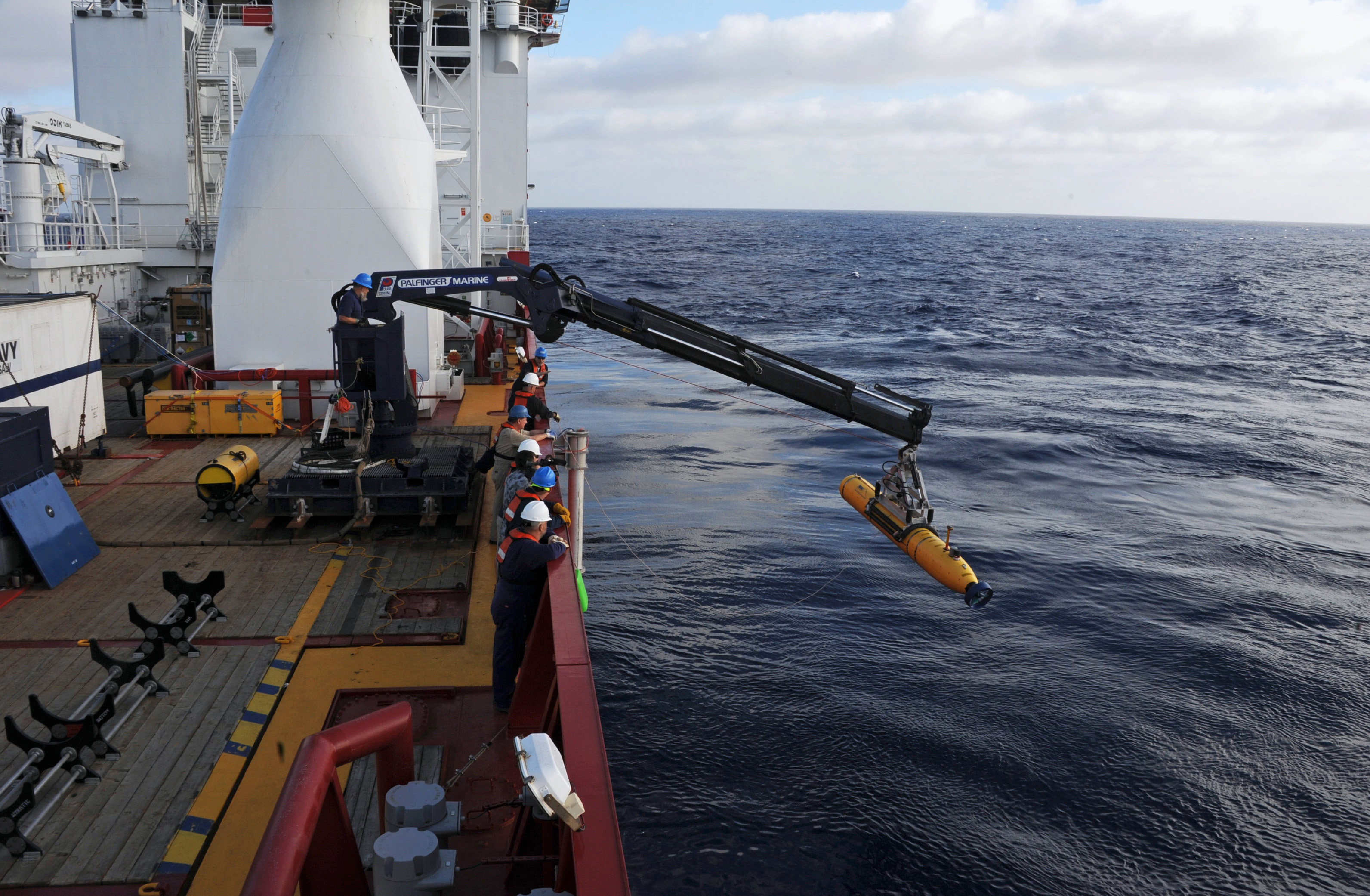Handout  of crew aboard the Australian Defence Vessel Ocean Shield moving the U.S. Navy's Bluefin-21 into position for deployment, in the southern Indian Ocean to look for the missing Malaysia Airlines flight MH370