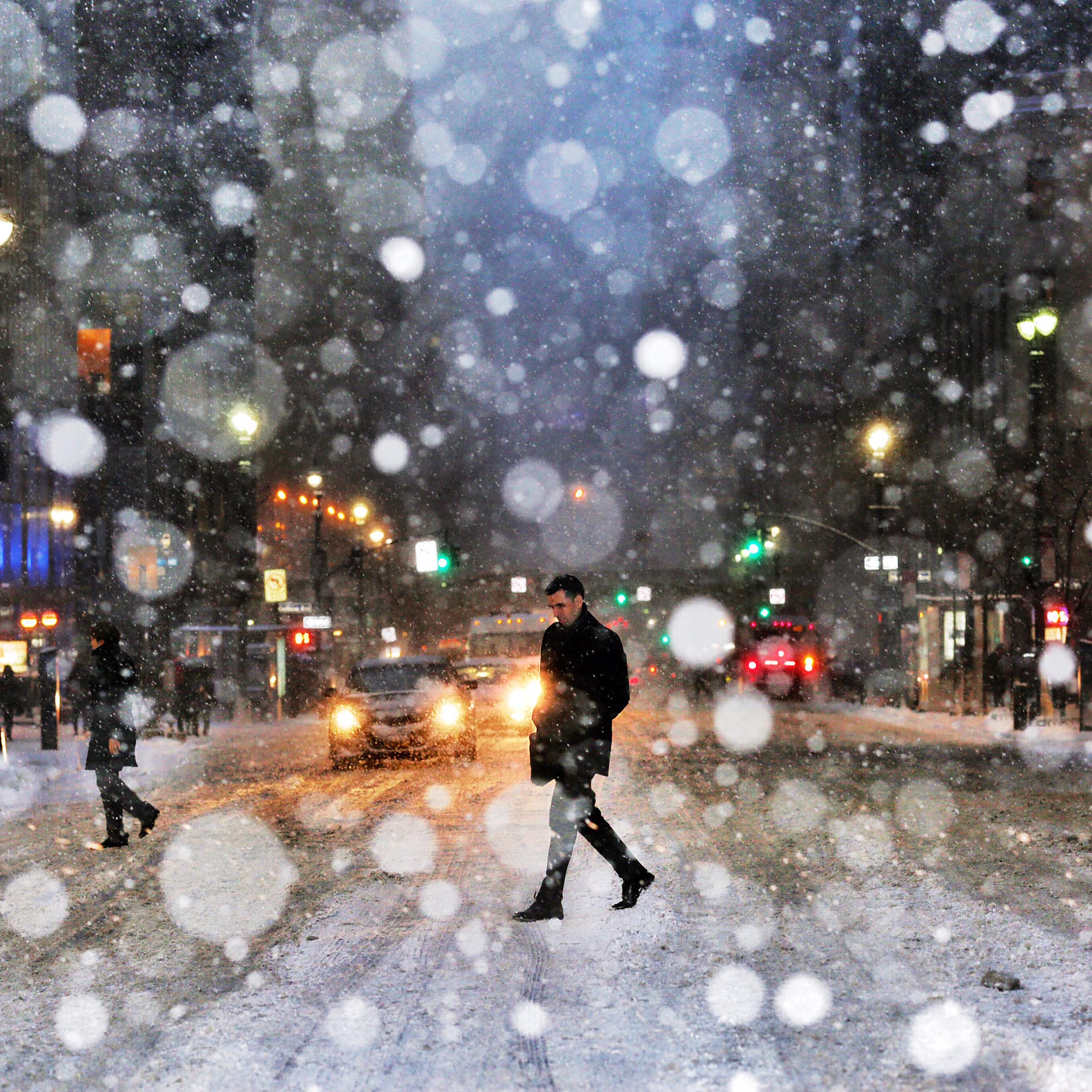 A man crosses the street in New York City during a snow storm in New York City on Jan. 26, 2015.