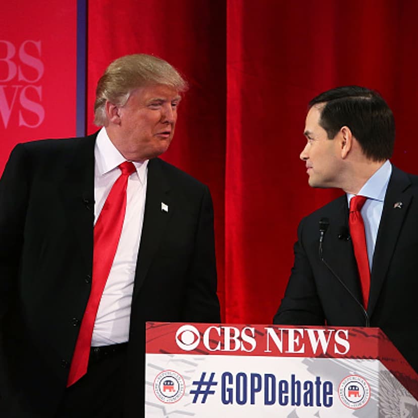 Republican presidential candidates Sen. Marco Rubio (R-FL) (R) listens to Donald Trump (L) during a break of a CBS News GOP Debate February 13, 2016 at the Peace Center in Greenville, South Carolina.