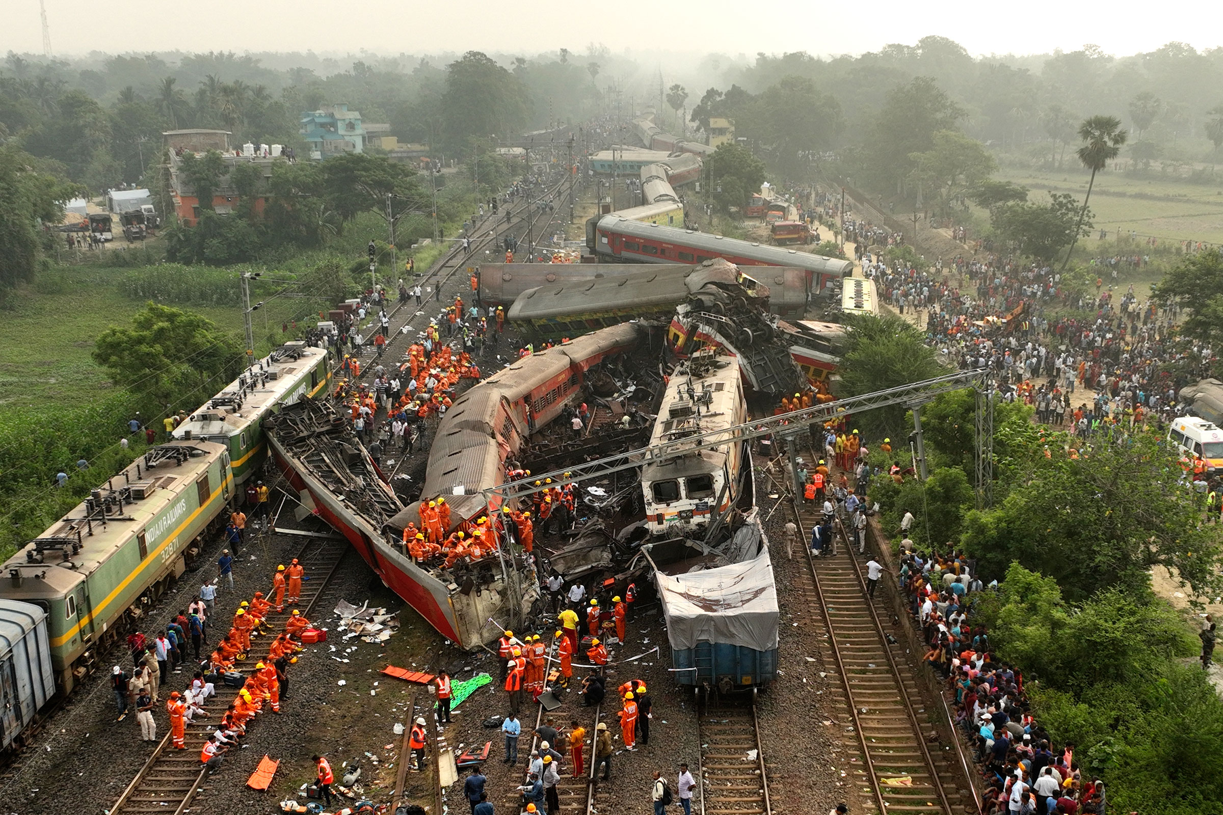 Rescuers work at the site of a passenger train accident in Balasore district, in the eastern Indian state of Orissa, on June 3, 2023. Two passenger trains derailed in India, killing more than 280 people. Hundreds of others were trapped inside more than a