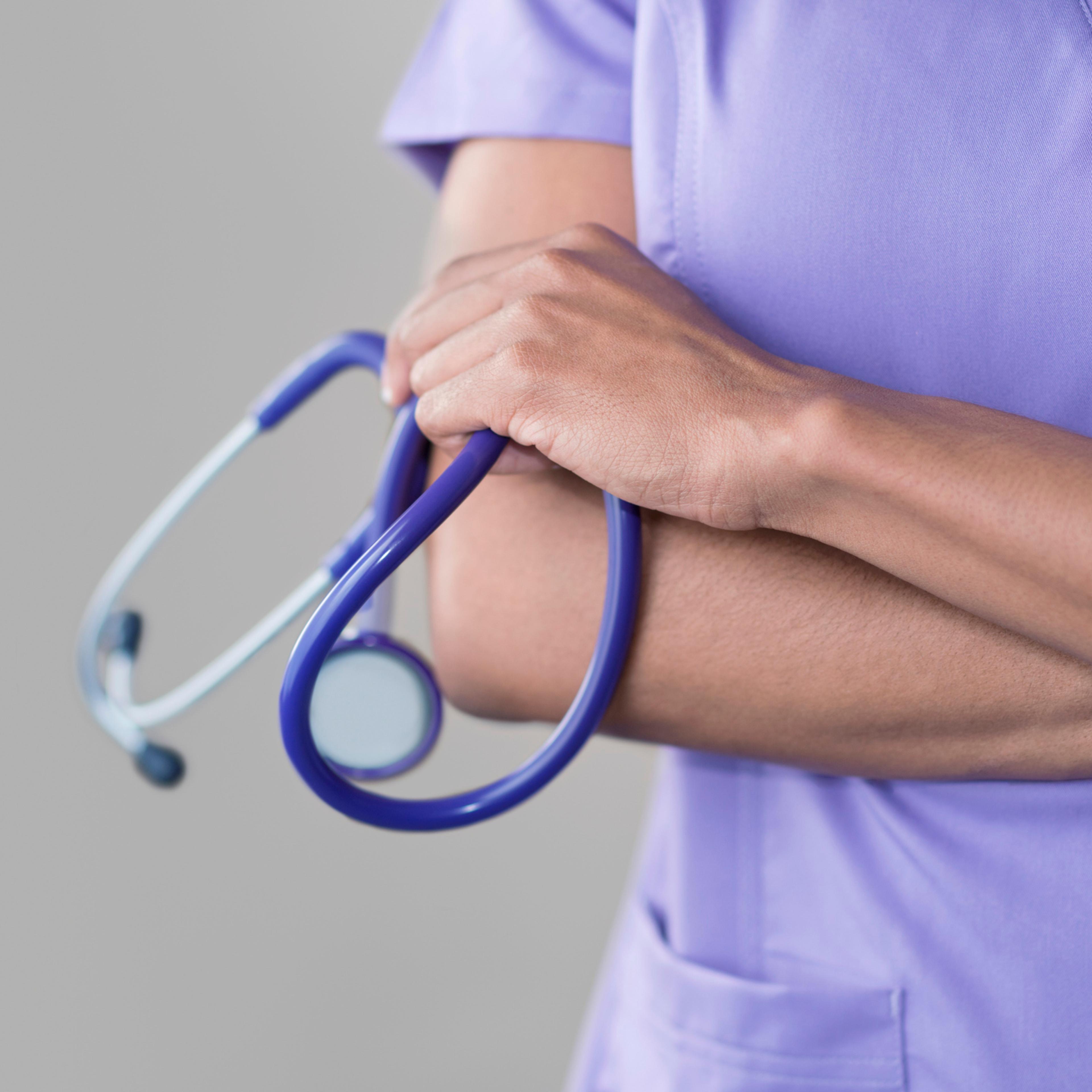 Female doctor holding stethoscope