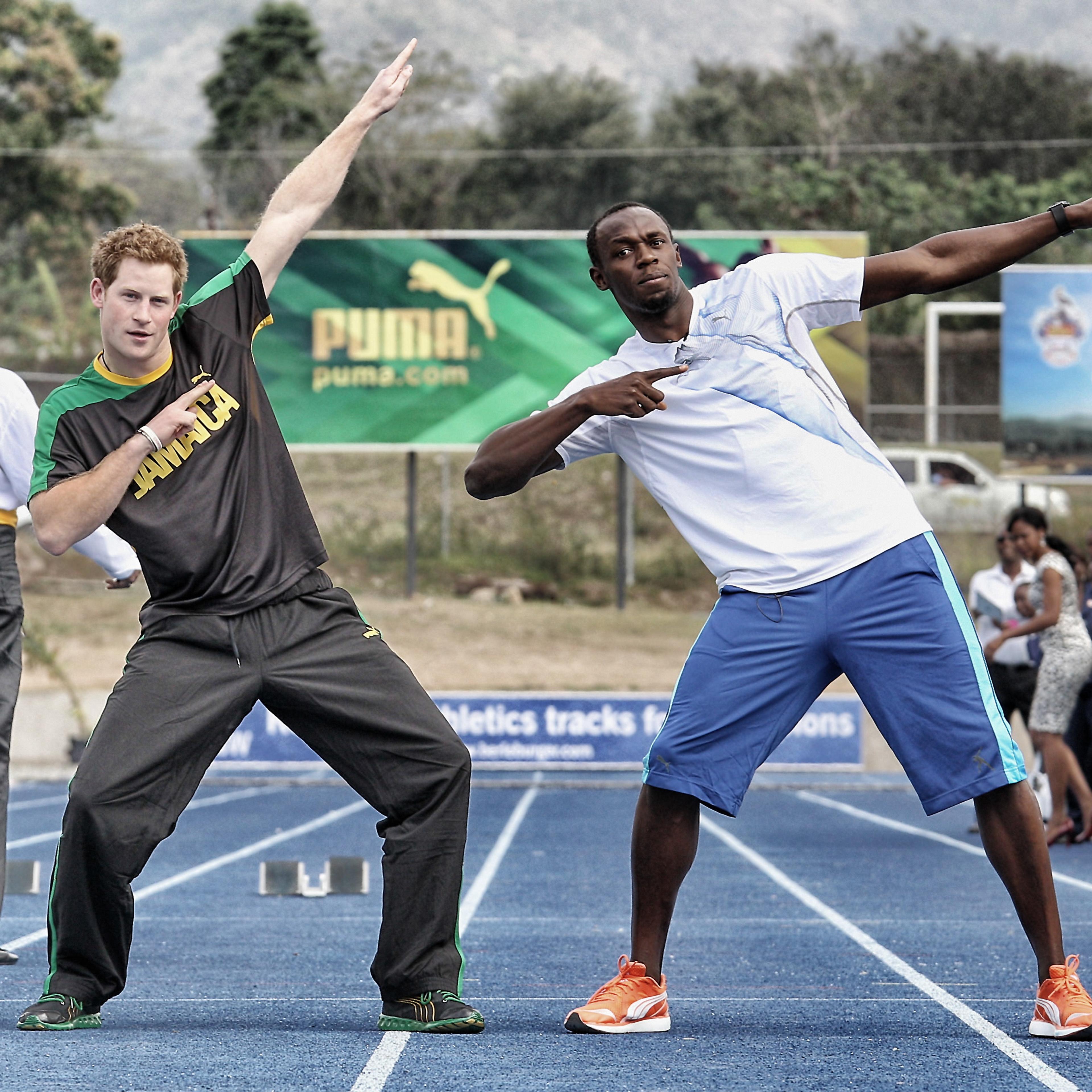 Prince Harry races Usain Bolt at the Usain Bolt Track at the University of the West Indies in Kingston, Jamaica on March 6, 2012.