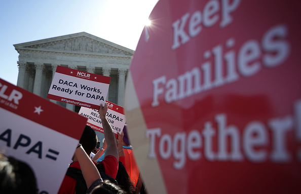 Pro-immigration activists gather in front of the U.S. Supreme Court on April 18, 2016 in Washington, DC.