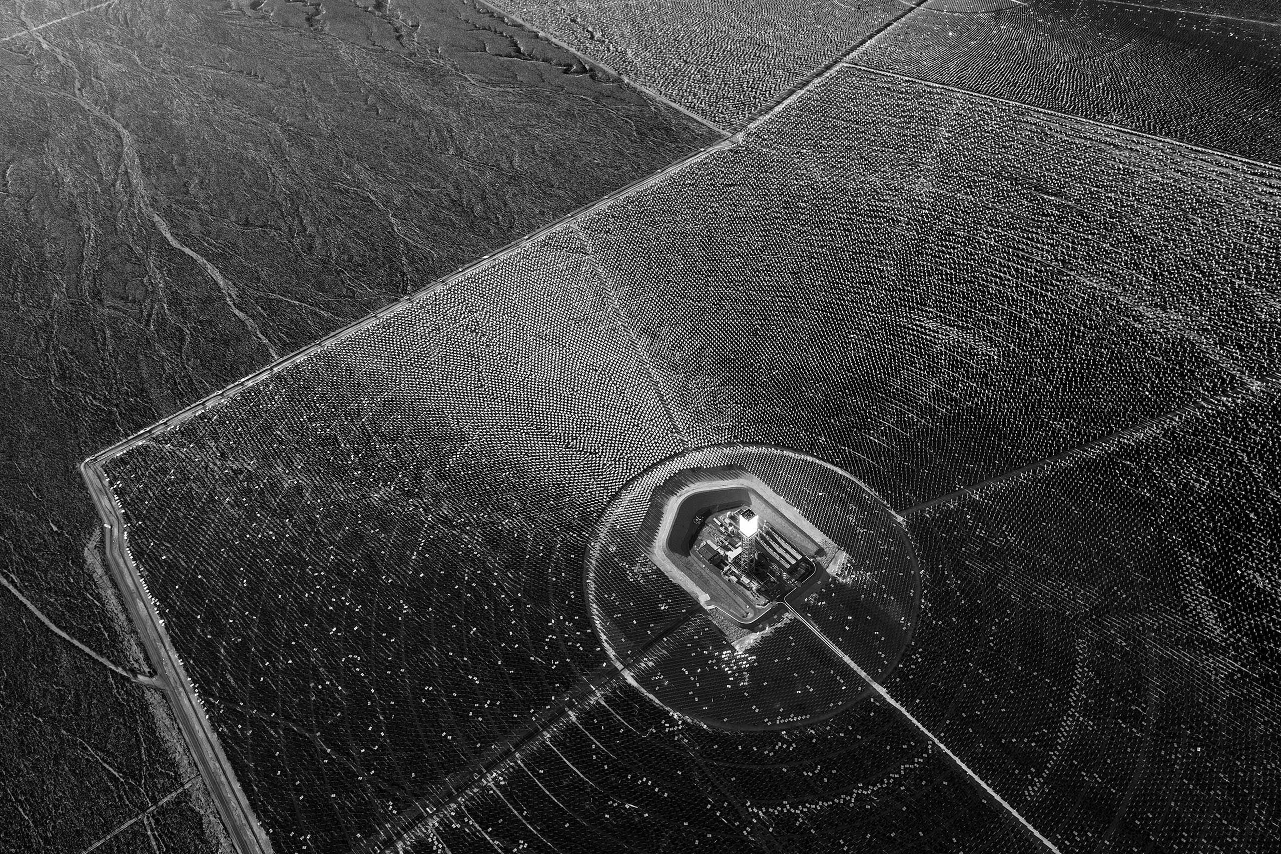 350, 000 mirrored heliostats reflect light onto boilers generating 392 megawatts of energy at the Ivanpah Solar power station in the Mojave Desert, California. Jamey Stillings