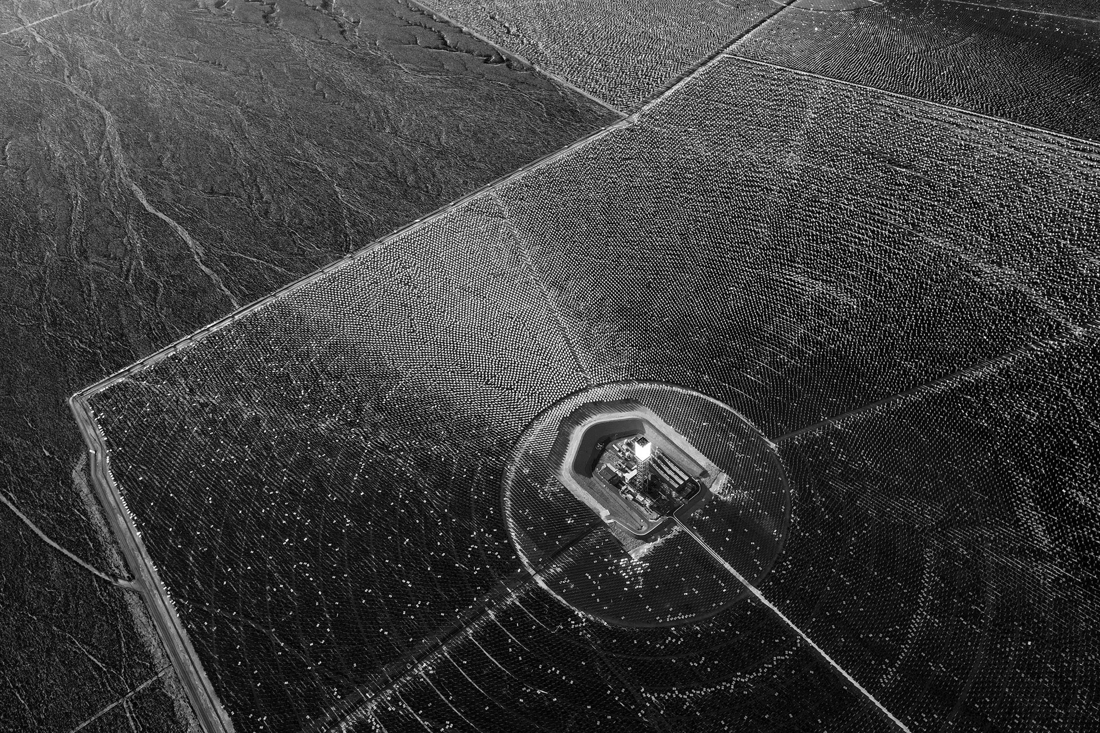 350, 000 mirrored heliostats reflect light onto boilers generating 392 megawatts of energy at the Ivanpah Solar power station in the Mojave Desert, California. Jamey Stillings