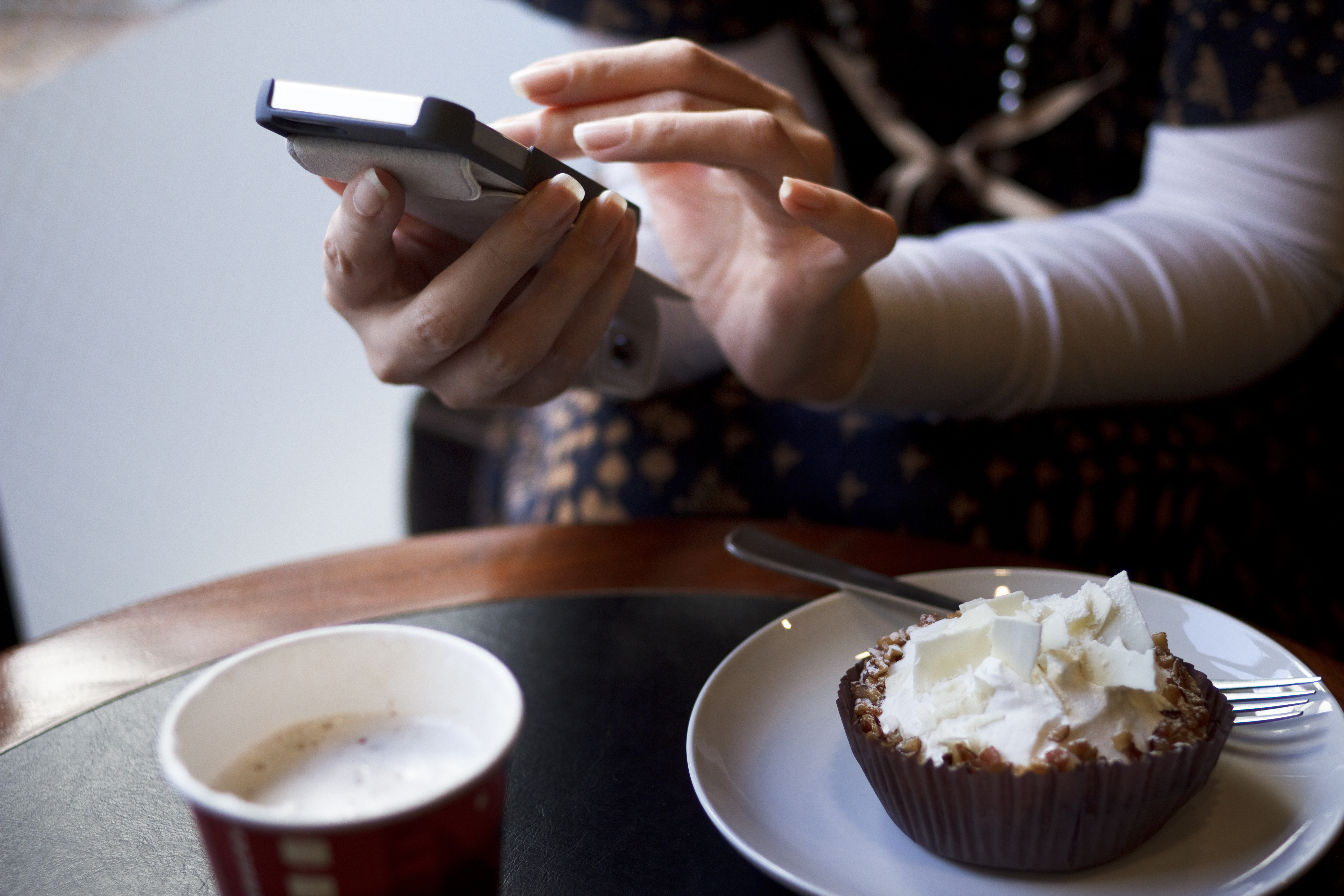 Woman typing on mobile phone