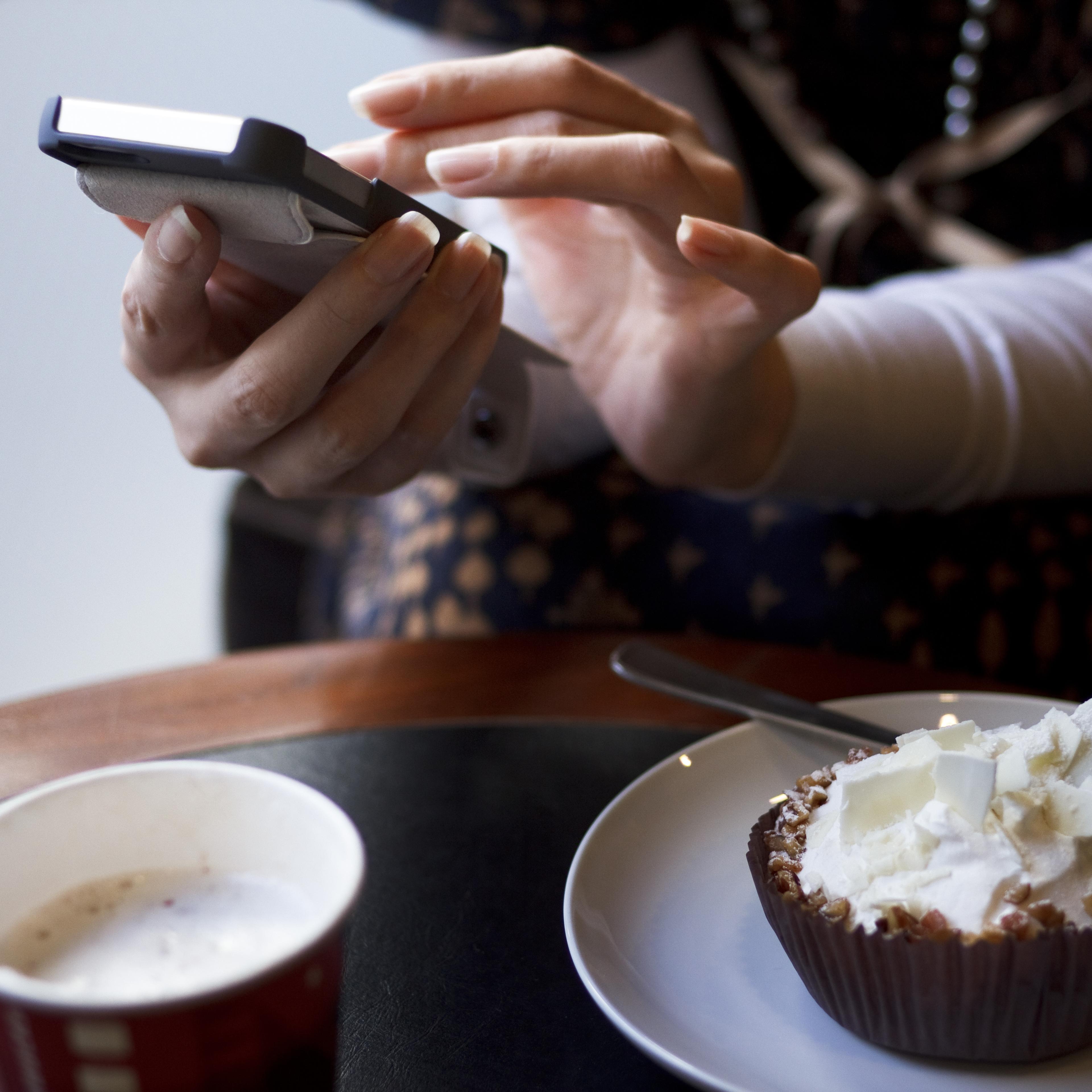 Woman typing on mobile phone
