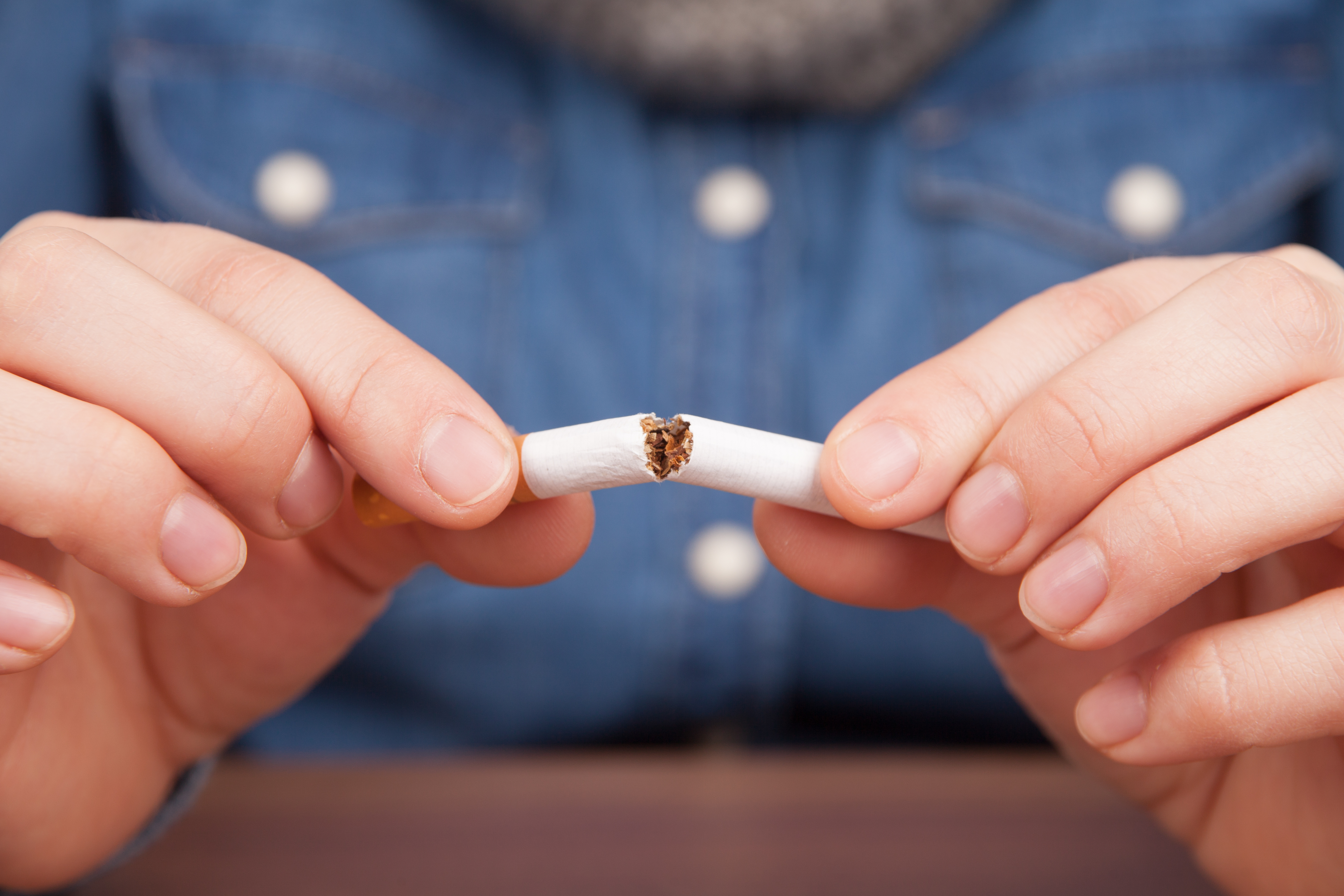 Close-Up Of Man Holding Cigarette