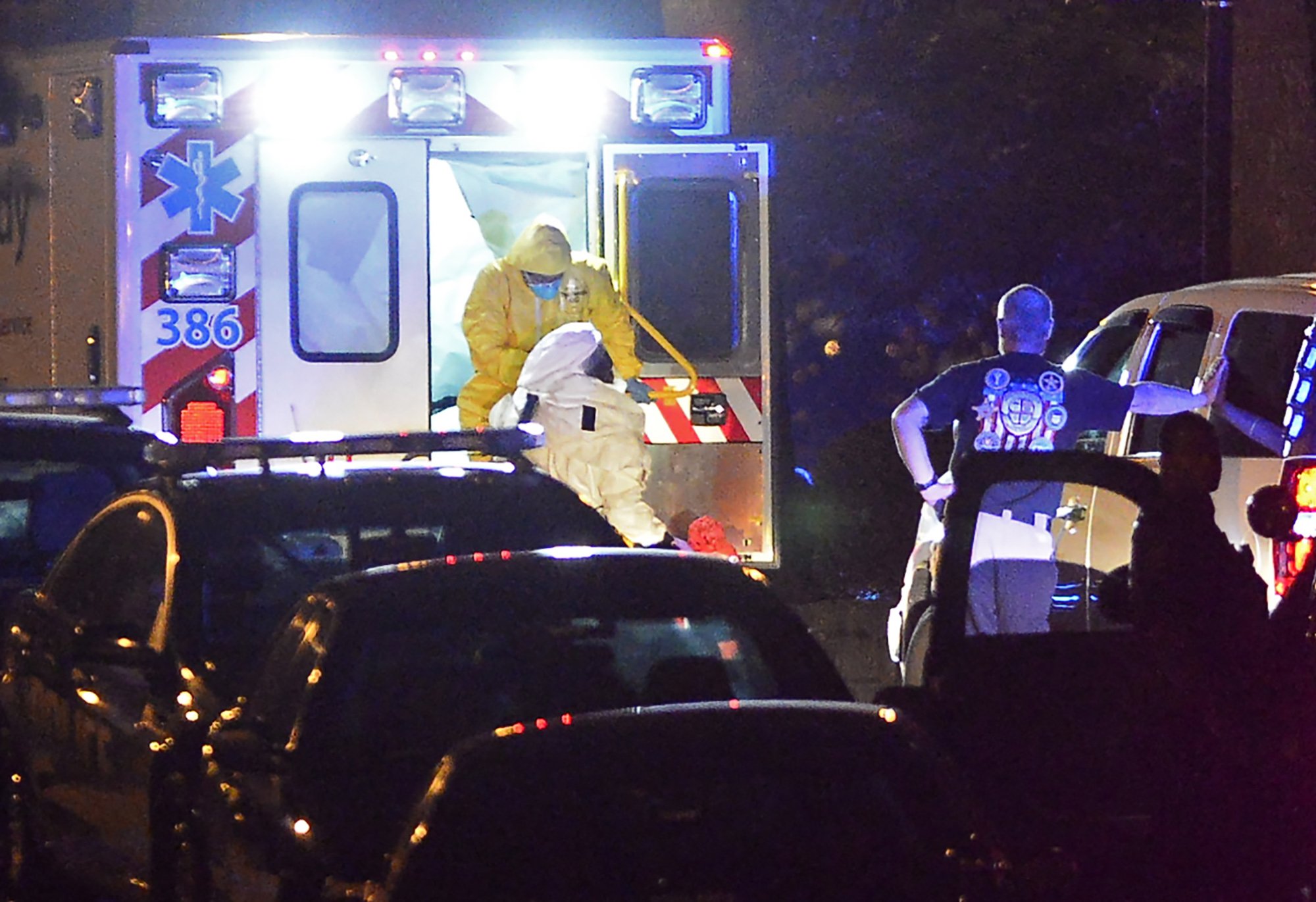 An ambulance carrying Amber Vinson, the second health care worker to be diagnosed with Ebola in Texas, arrives at Emory University Hospital on Oct. 15, 2014 in Atlanta.