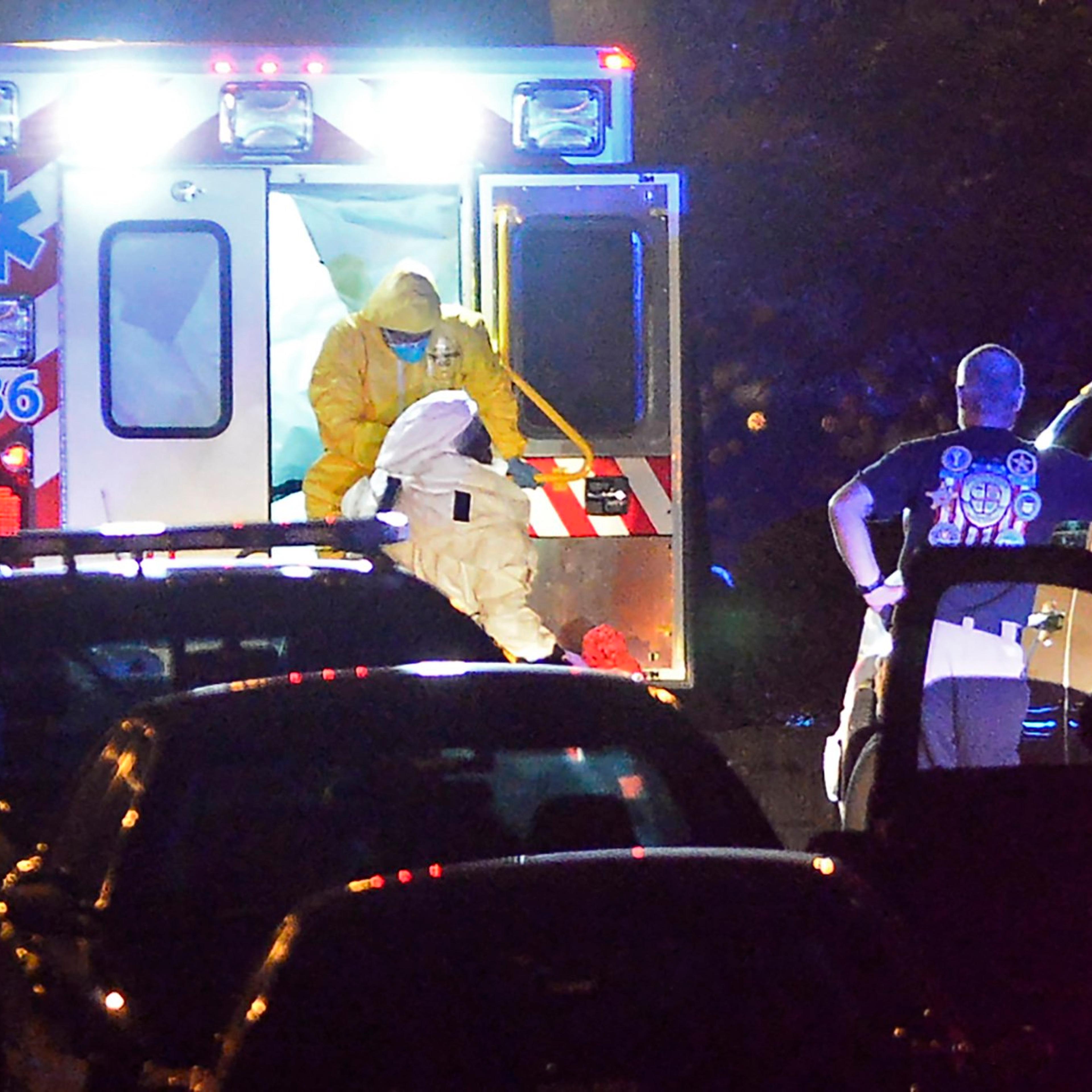 An ambulance carrying Amber Vinson, the second health care worker to be diagnosed with Ebola in Texas, arrives at Emory University Hospital on Oct. 15, 2014 in Atlanta.