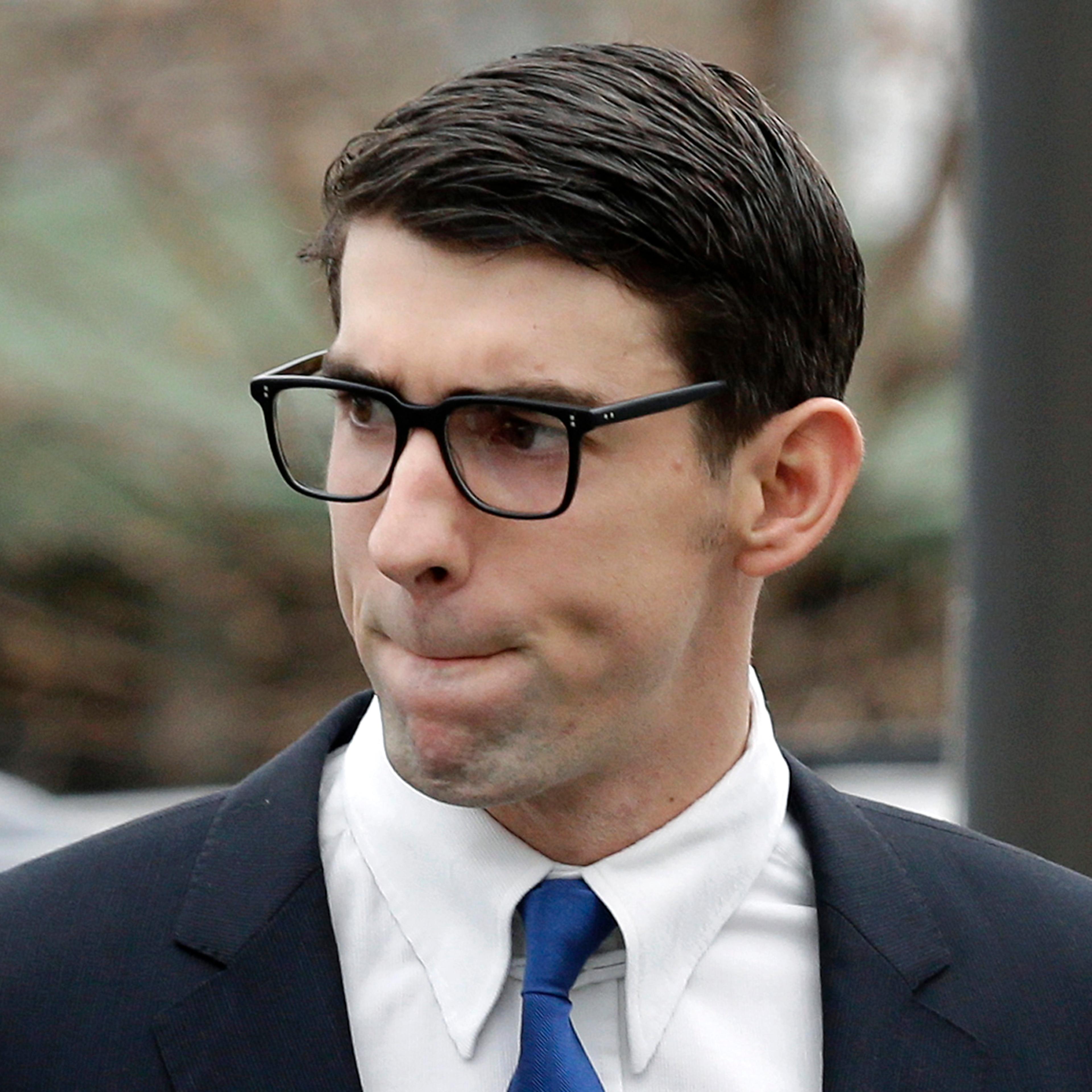 Olympic swimmer Michael Phelps walks into a courthouse in Baltimore, Md. for a trial on drunken driving and other charges on Dec. 19, 2014.