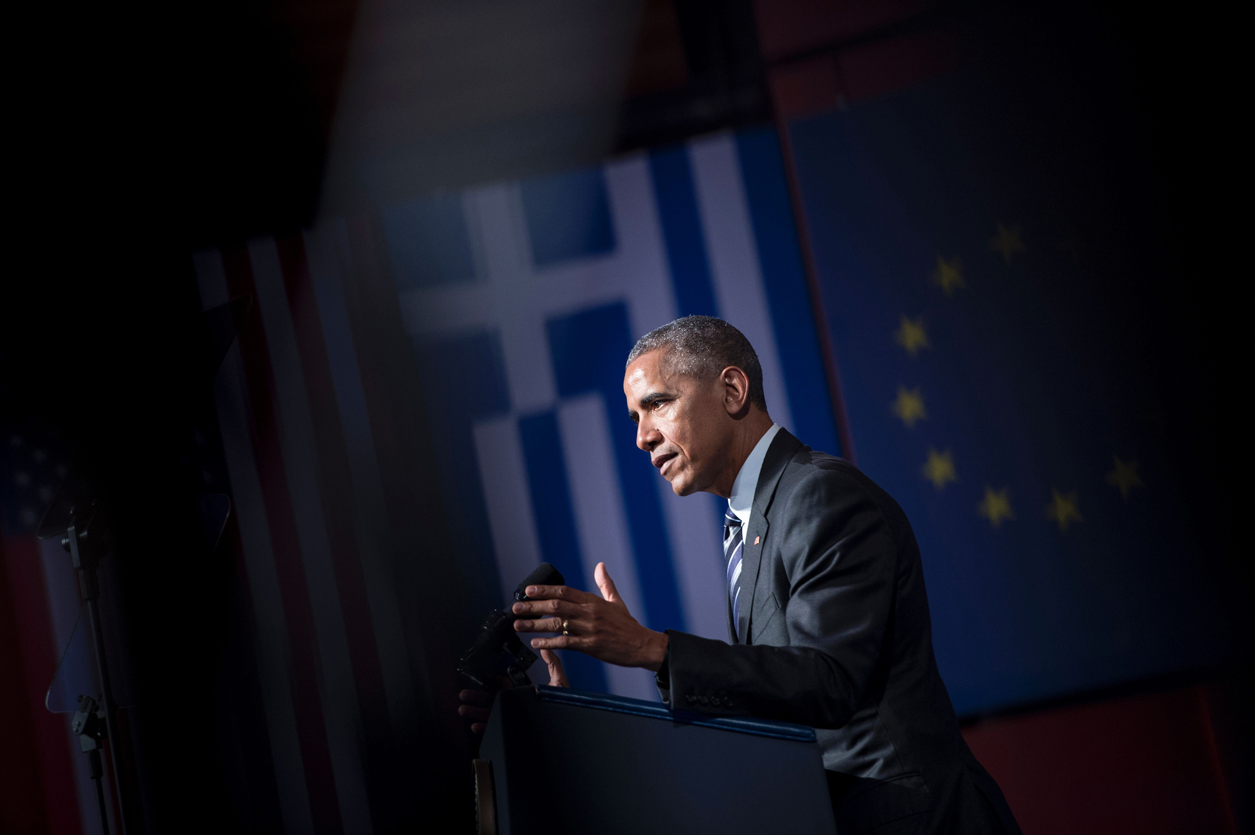 TOPSHOT - US President Barack Obama delivers a speech at the Stavros Niarchos Foundation Cultural Center on November 16, 2016 in Athens, Greece. Obama was on November 16 wrapping up the Greek leg of a farewell European trip with a visit to the Acropolis 