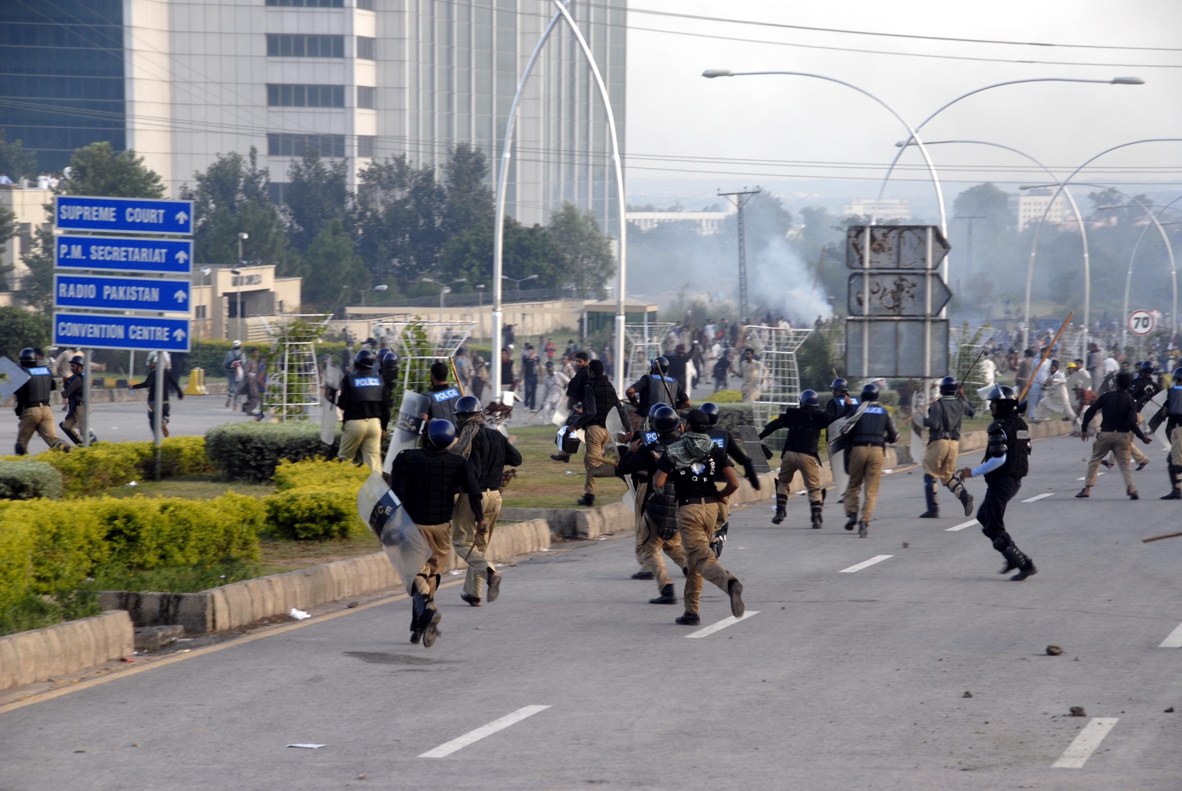 Supporters of Imran Khan and Tahir-ul-Qadri, attack