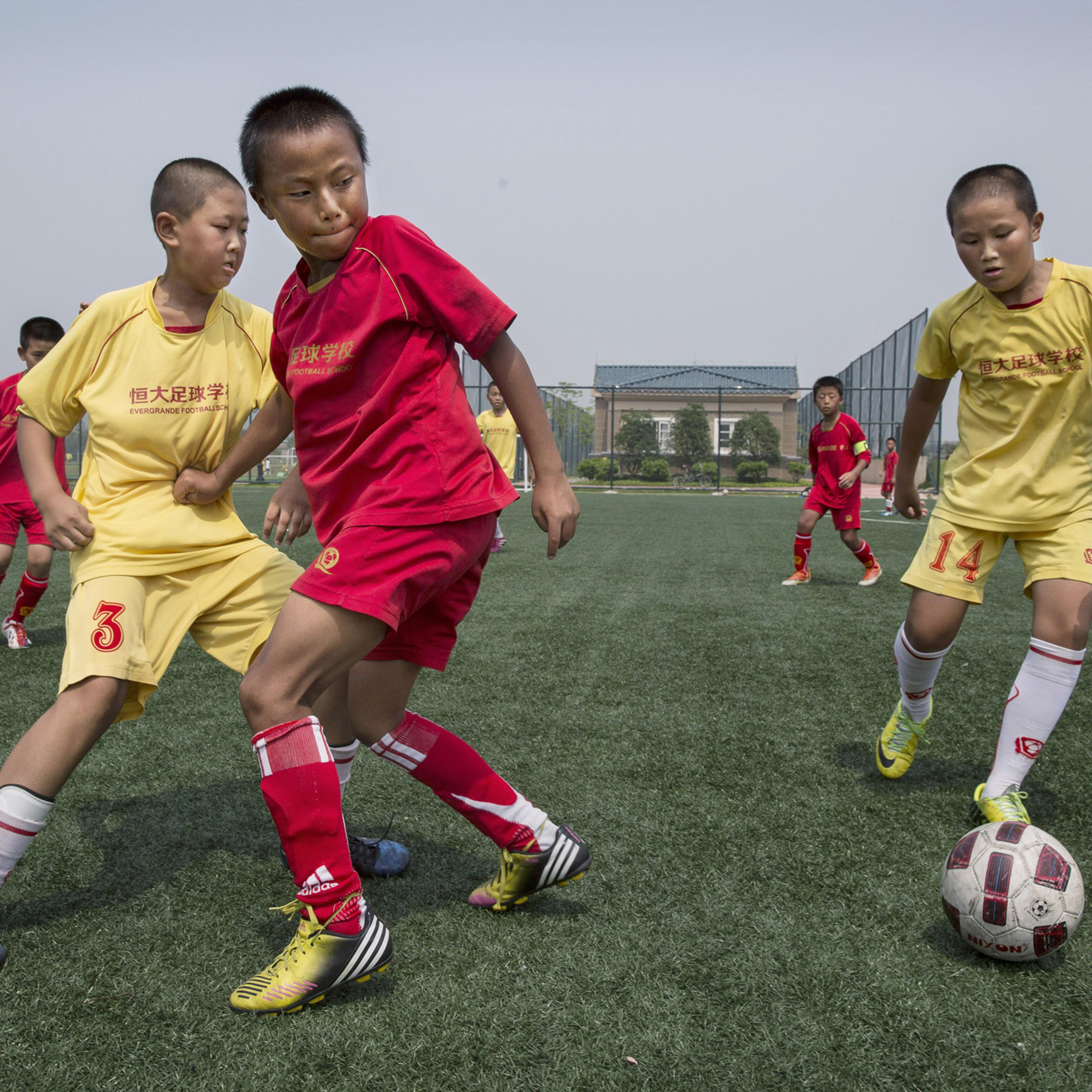 A match on a practice pitch at the Evergrande International Football School on June 14.