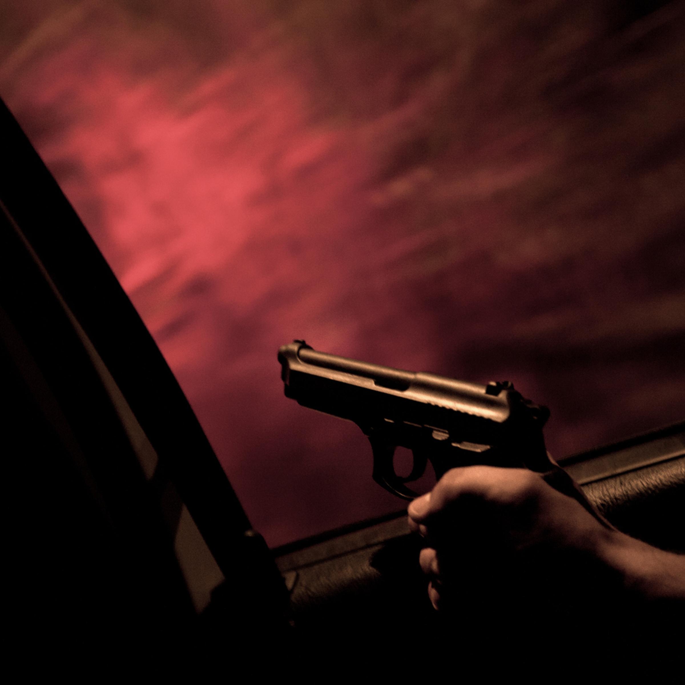 <i>The following photos were taken in Rio de Janeiro, Brazil in February and May 2012.</i>
<br><br>
Unidade de Polícia Pacificadora (UPP) soldier Alexandre Correa holds his service gun out the window of a police car while on patrol in the Sao Carlos favela.
Initiated in 2008, the UPP is a new system of community policing in Rio de Janeiro’s favelas, which were once run by drug traffickers.