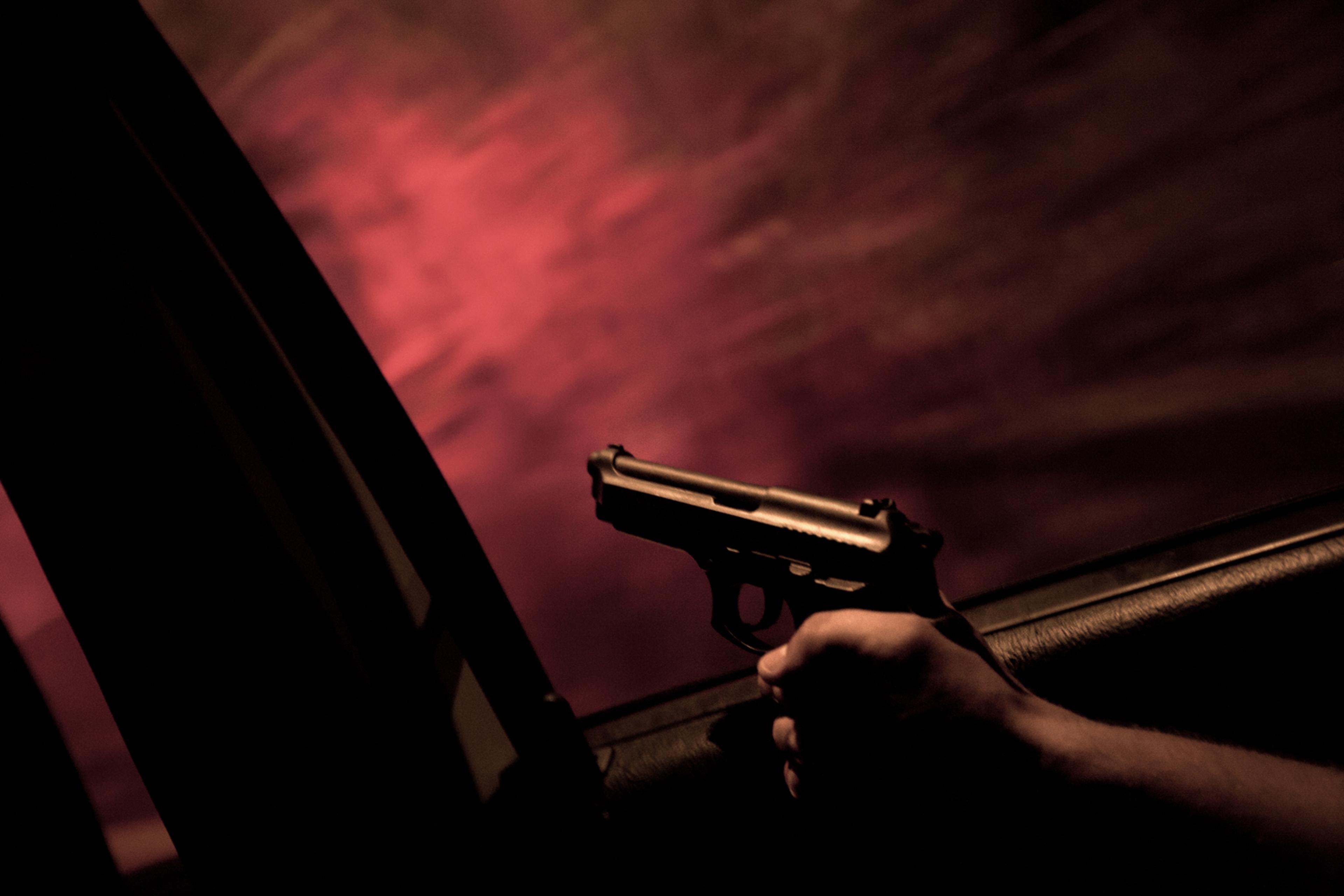 The following photos were taken in Rio de Janeiro, Brazil in February and May 2012. Unidade de Polícia Pacificadora (UPP) soldier Alexandre Correa holds his service gun out the window of a police car while on patrol in the Sao Carlos favela. Initiated in 2008, the UPP is a new system of community policing in Rio de Janeiro’s favelas, which were once run by drug traffickers.