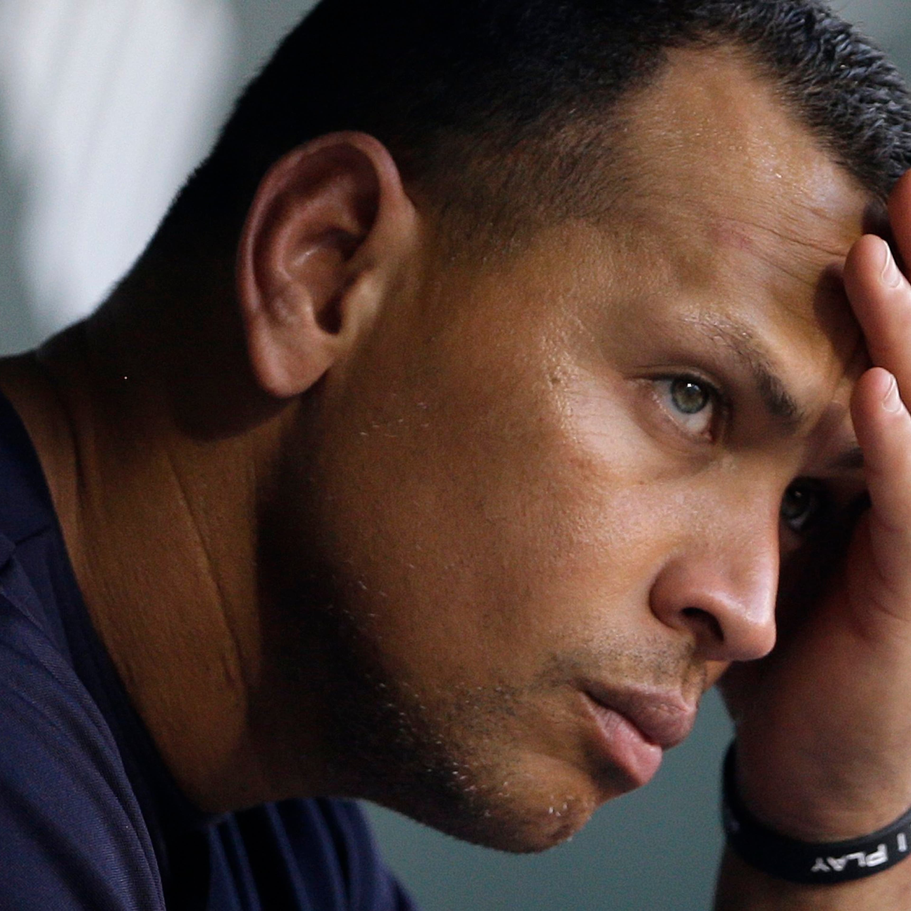 New York Yankees' Alex Rodriguez wipes sweat from his brow as he sits in the dugout before a baseball game against the Baltimore Orioles in Baltimore on Sept. 11, 2013.